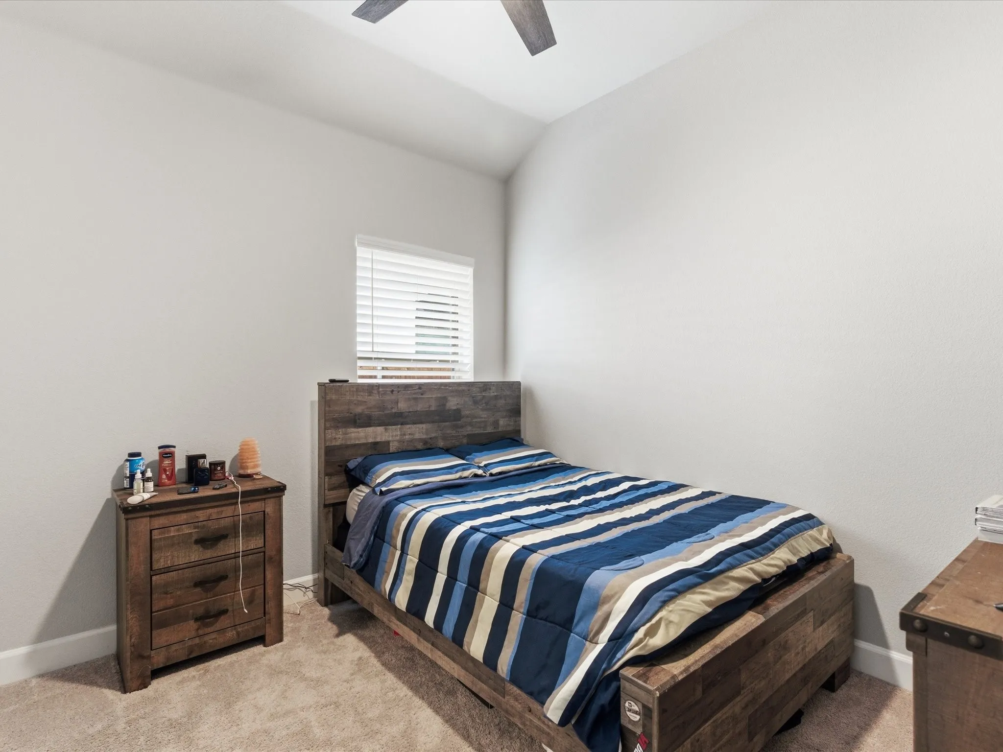 well-appointed bedroom with a laid-back and inviting feel, offering a comfortable space to unwind, relax, and enjoy a peaceful retreat