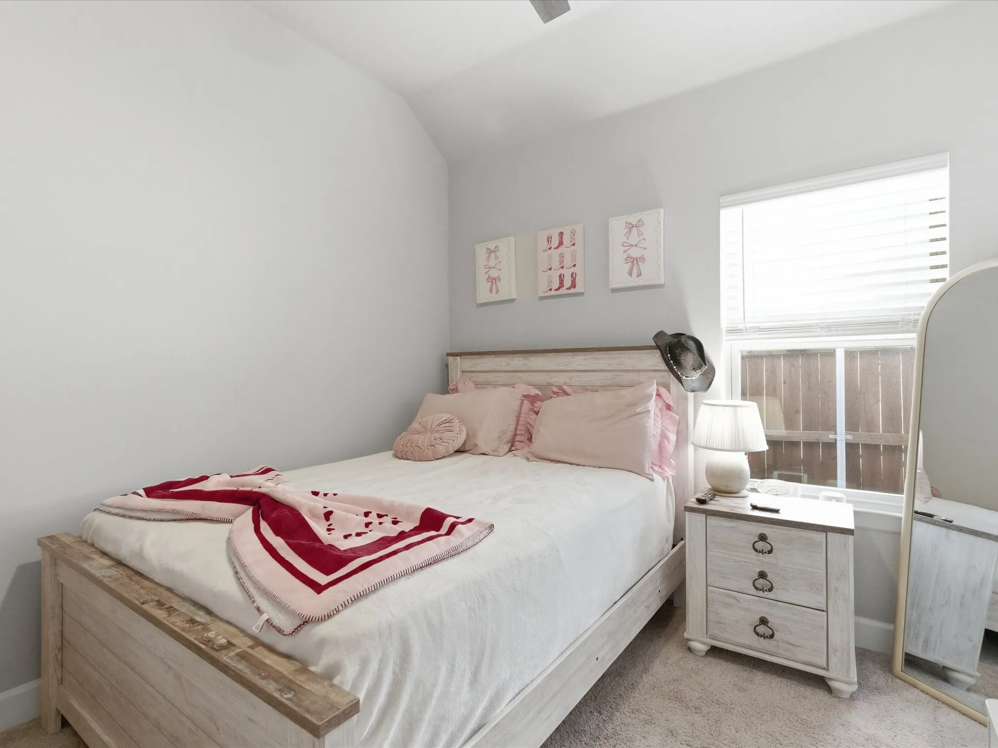 charming and cozy bedroom with a warm, inviting feel, creating a delightful space to relax, unwind, and enjoy a peaceful night’s rest