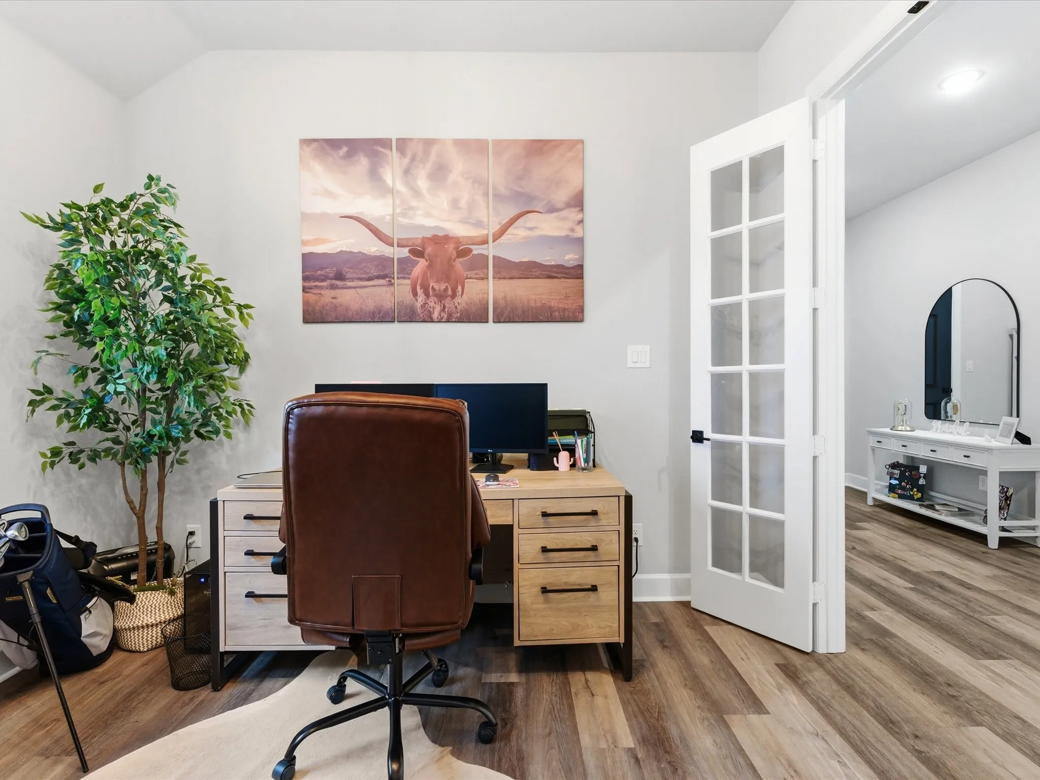 bright and inviting home office with a dedicated workspace, offering a comfortable setting for staying productive, focused, and organized