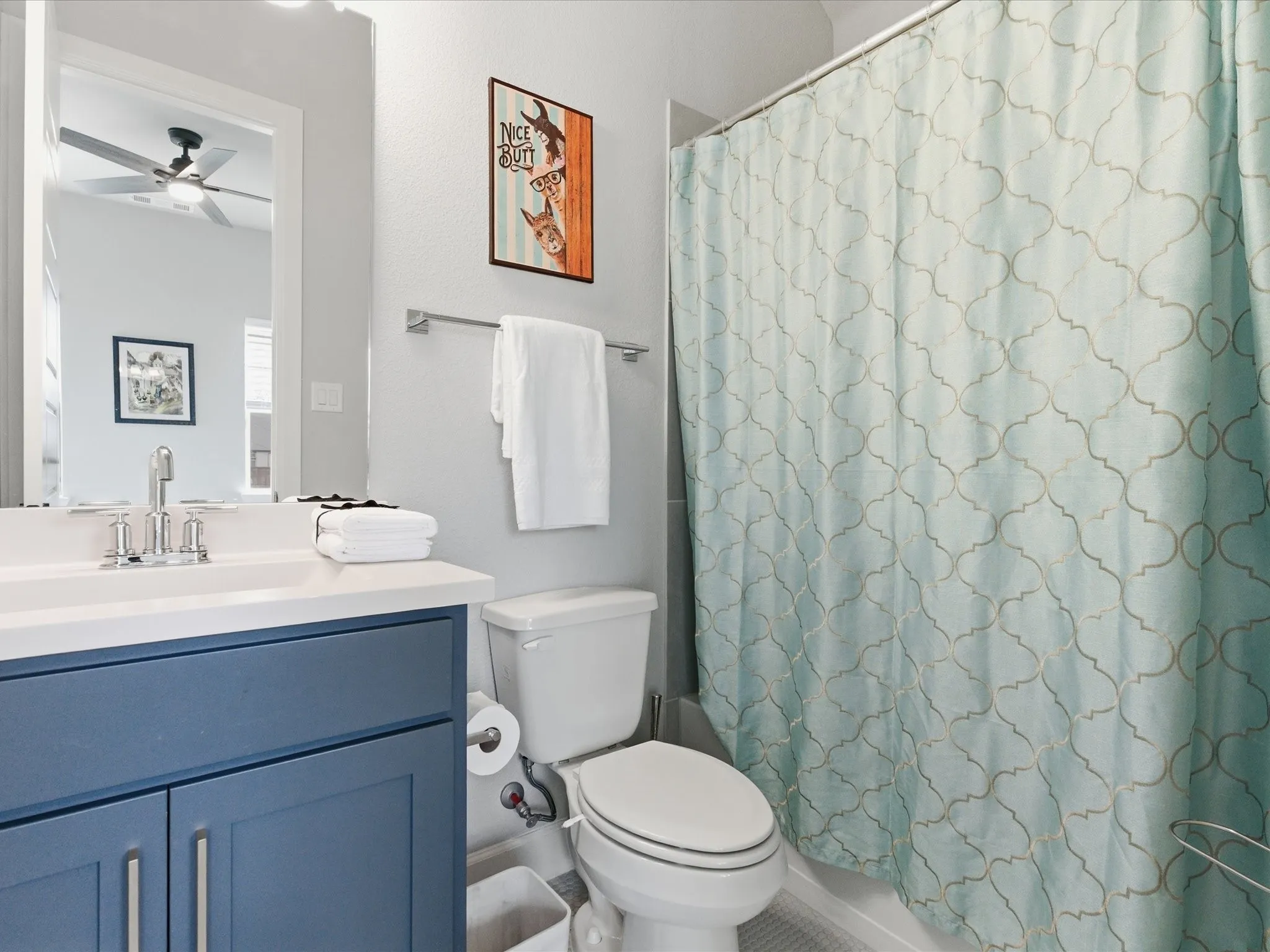 cozy bathroom with a clean, refined design, creating a comfortable and inviting space for everyday routines and relaxation