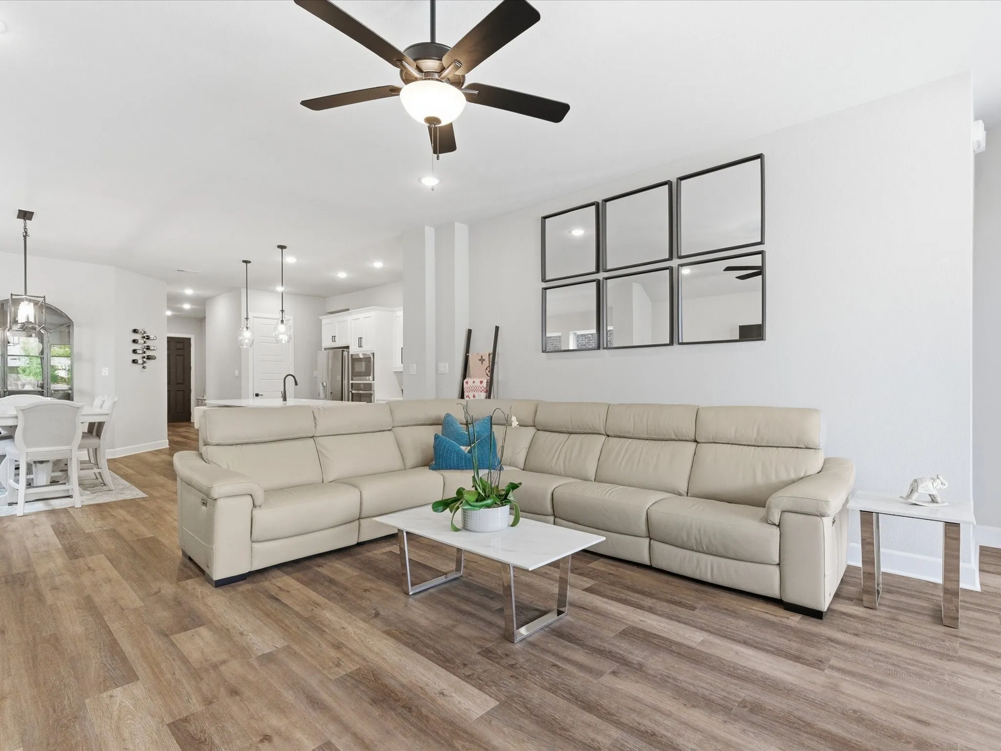 beautifully designed living room with an open, sophisticated feel, offering an inviting space to unwind, entertain, and gather in style