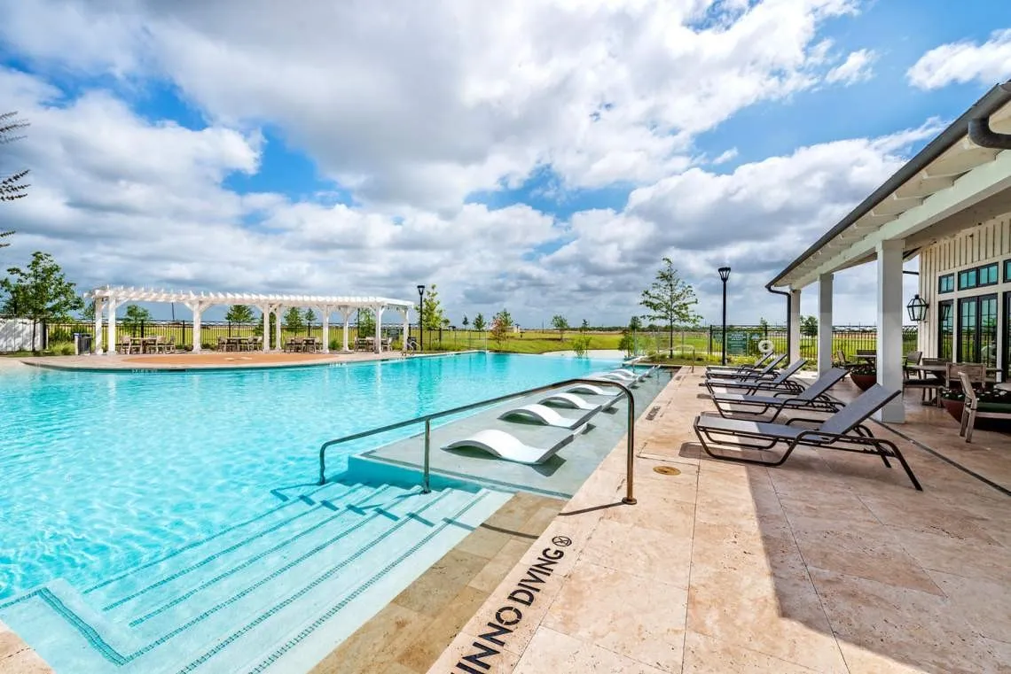 refreshing community pool offering a welcoming space to cool off, relax, and enjoy sunny days with family and friends