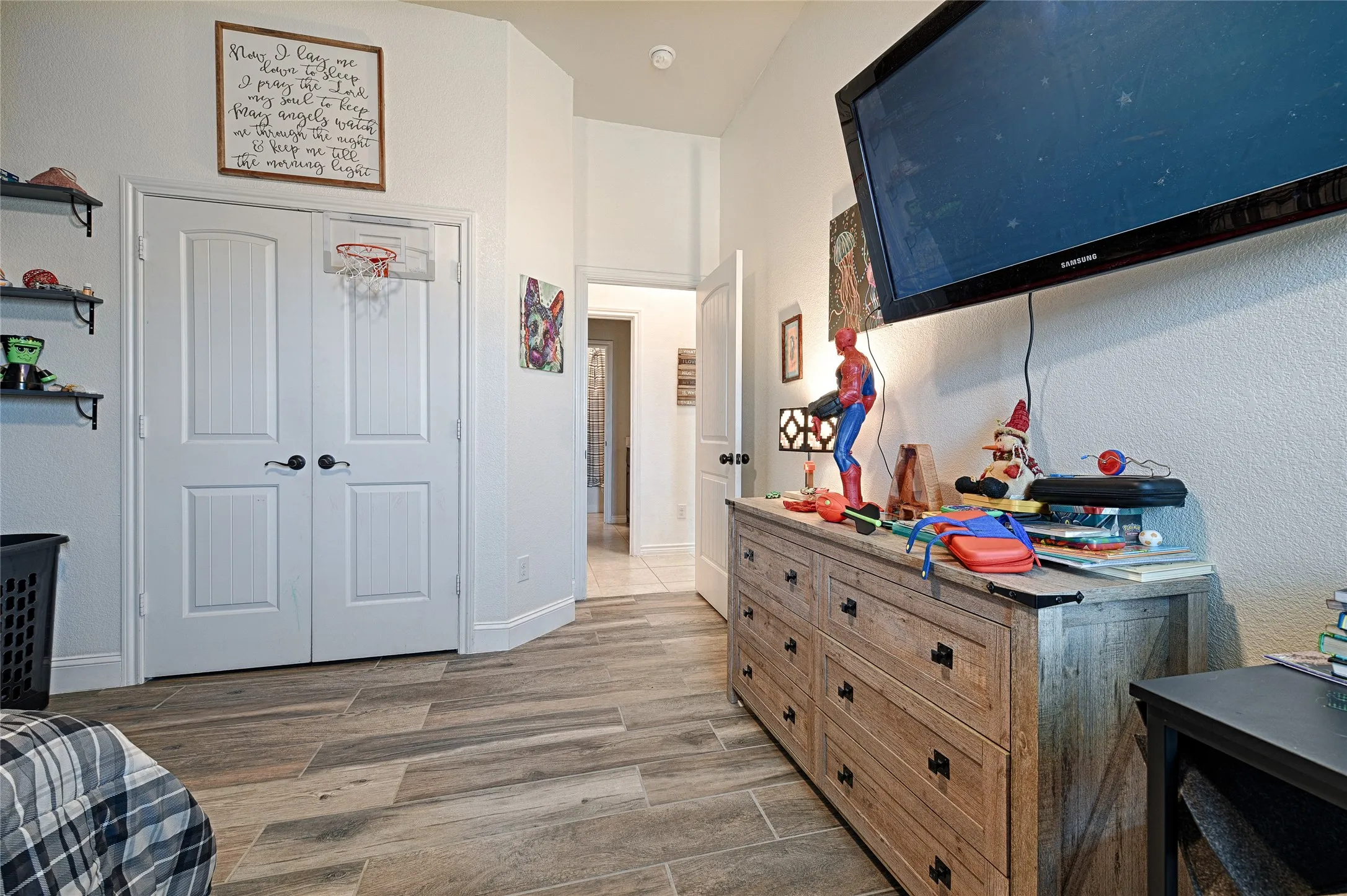 Bedroom with hardwood / wood-style floors