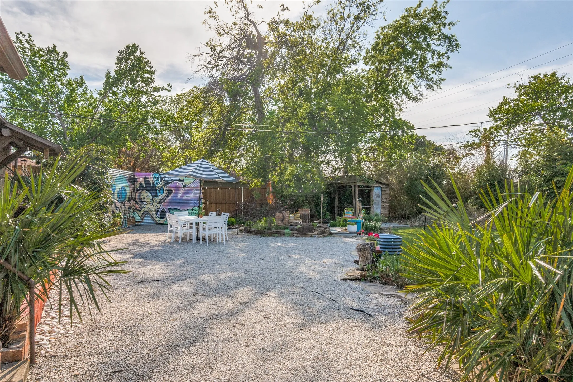 View of yard featuring fence and outdoor dining space