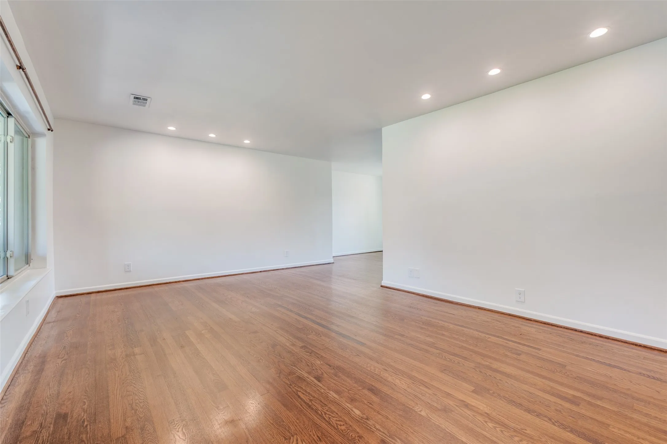 Spare room featuring baseboards, visible vents, wood finished floors, and recessed​​‌​​​​‌​​‌‌​‌‌​​​‌‌​‌​‌​‌​​​‌​​ lighting