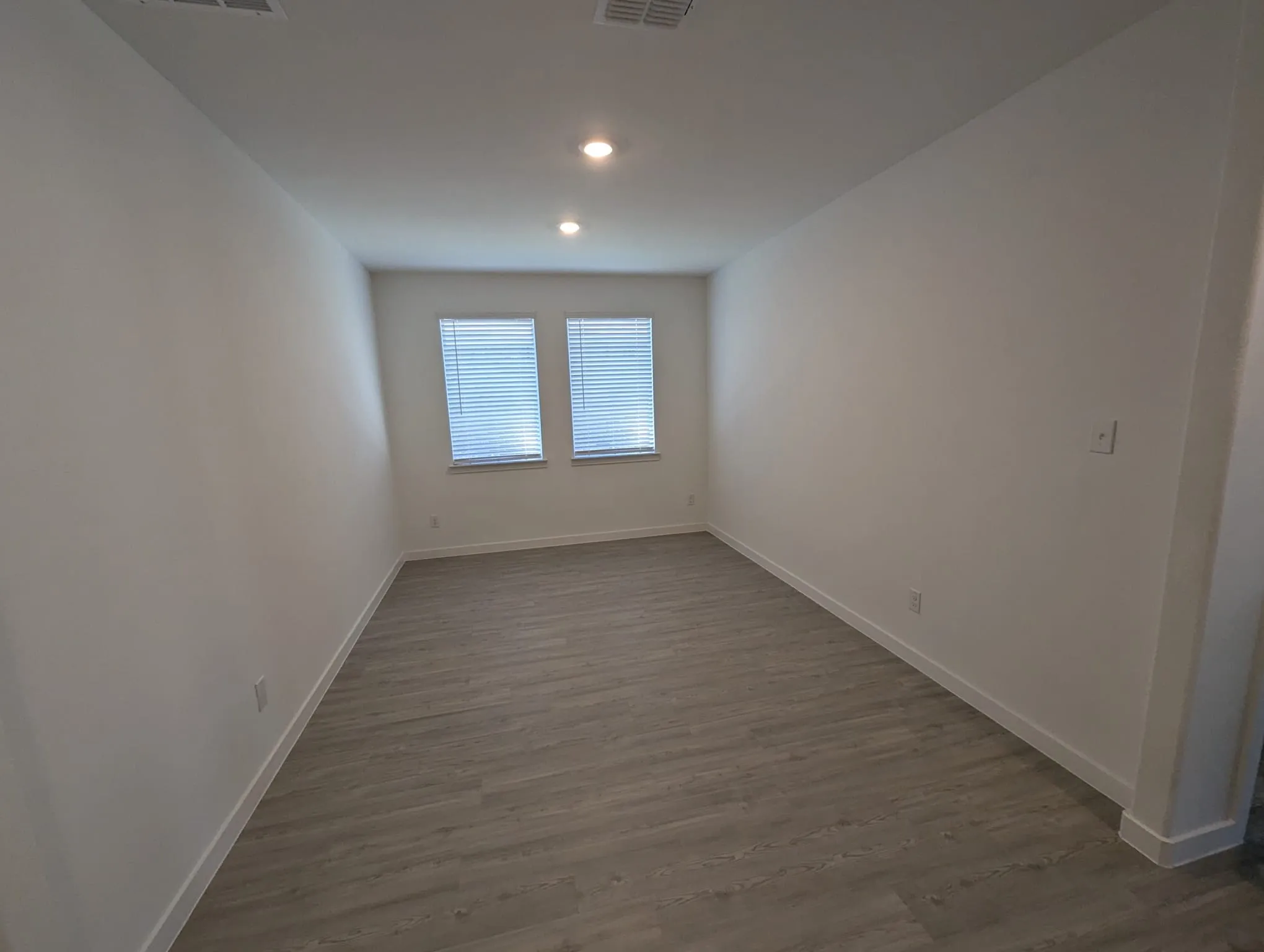 Spare room featuring dark hardwood / wood-style floors