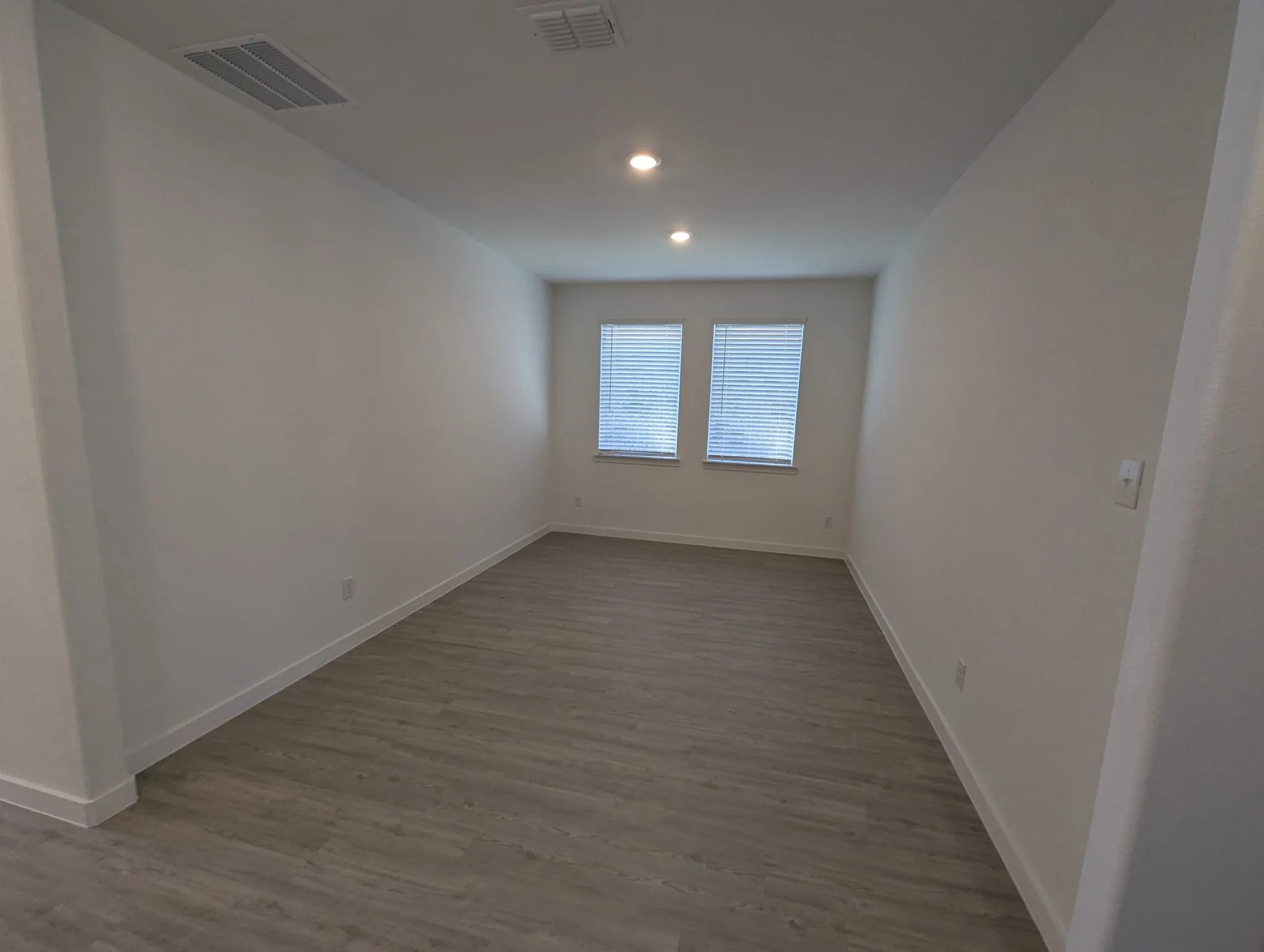 Unfurnished room featuring hardwood / wood-style flooring