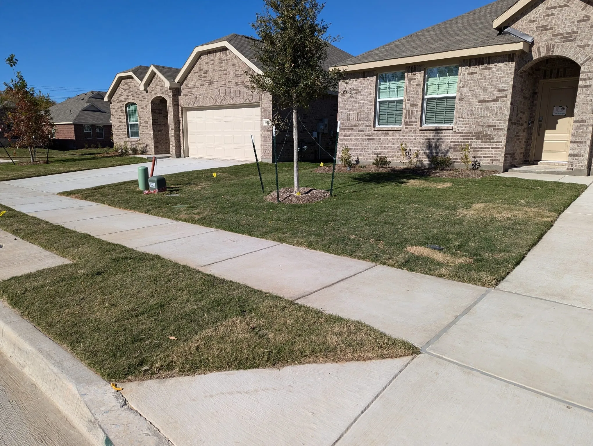 View of front of house featuring a front yard and a garage