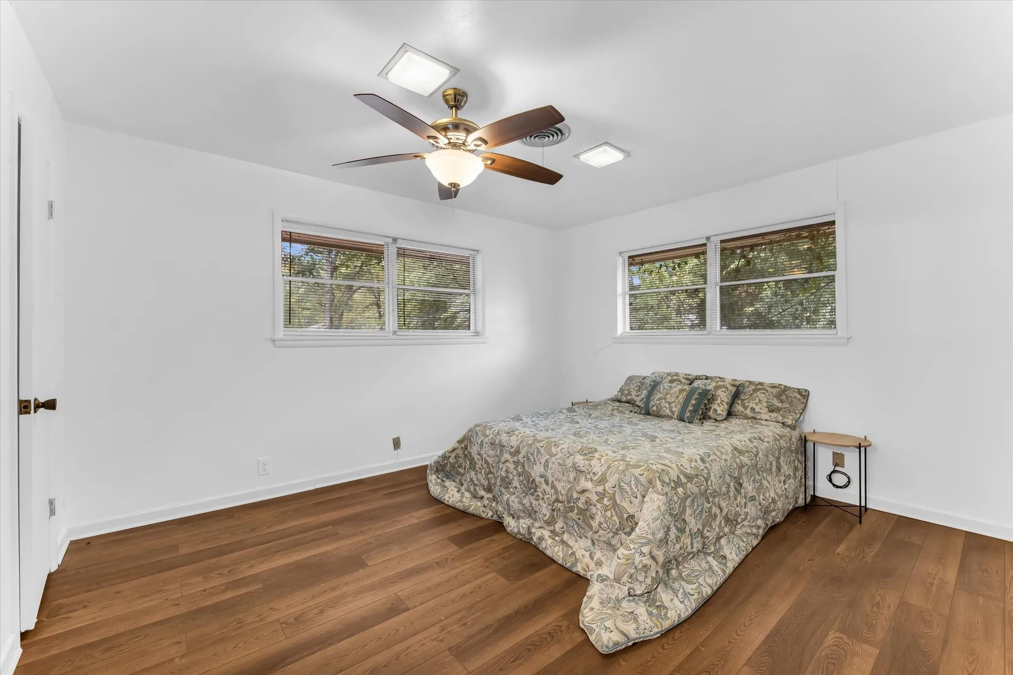 Spacious primary bedroom with dual closets and an en-suite bath.