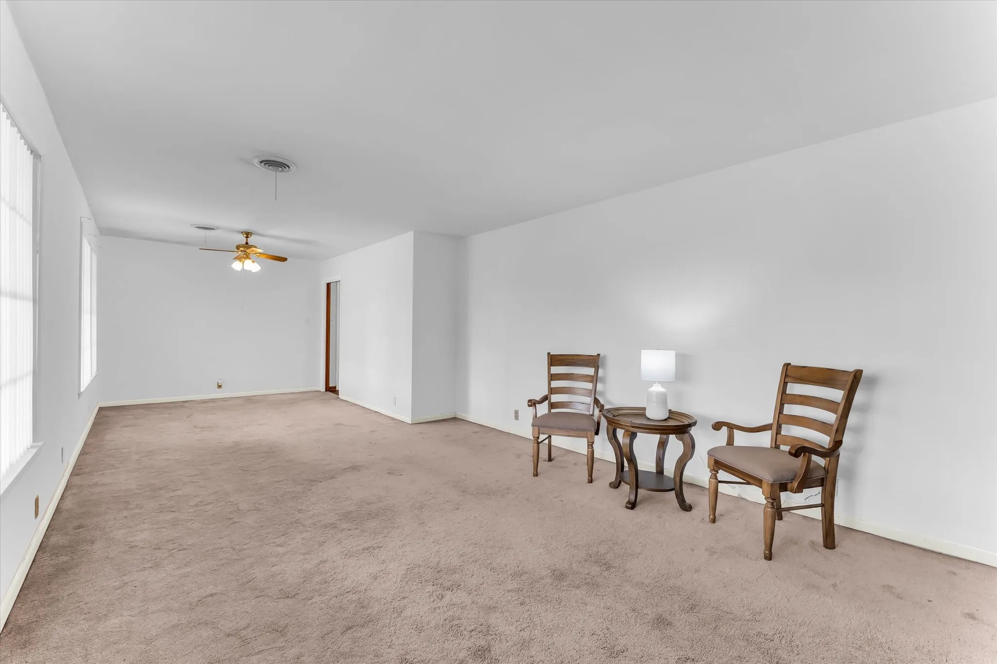 Formal living and dining area feature large windows and beautiful natural light.