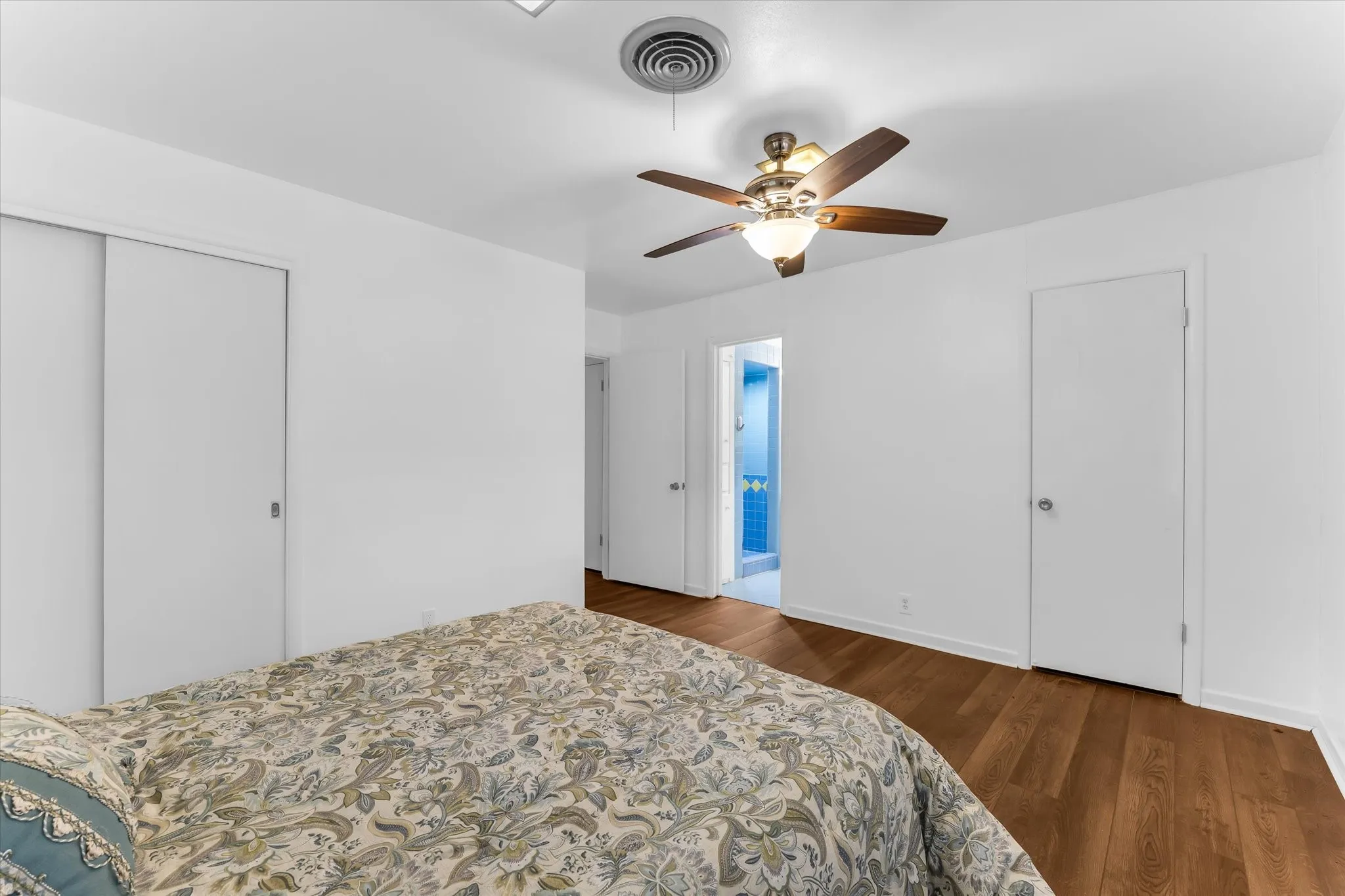 Spacious primary bedroom with dual closets and an en-suite bath.