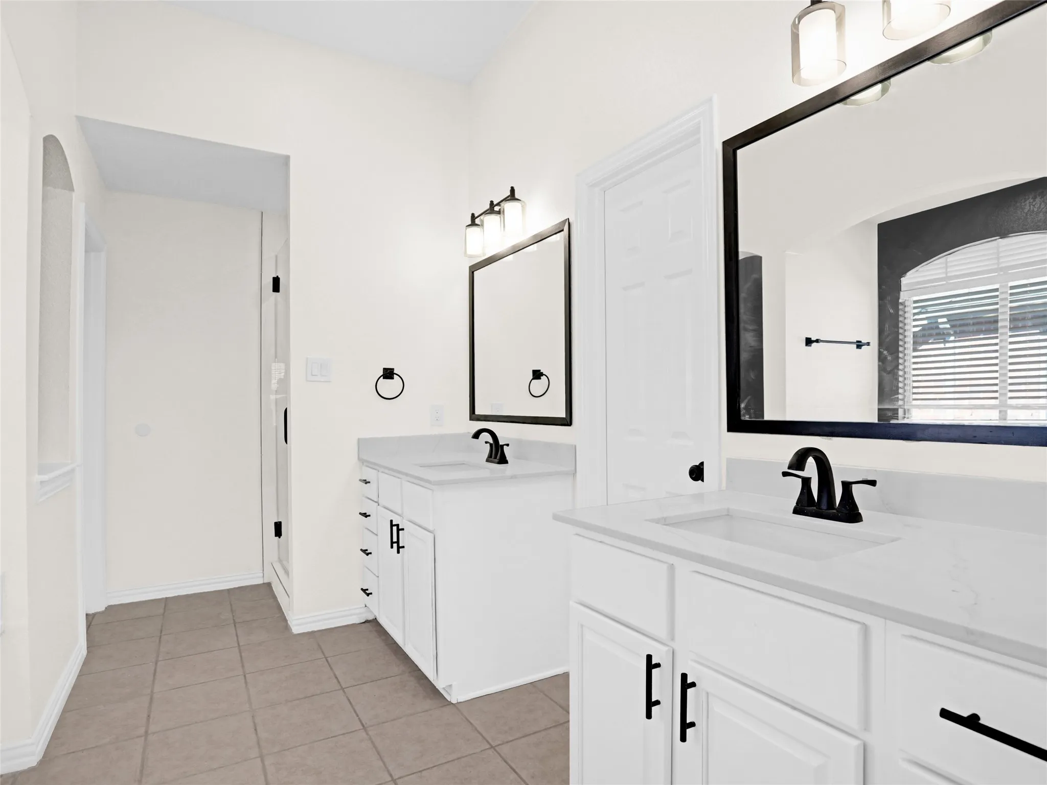 Separate his and hers vanities.