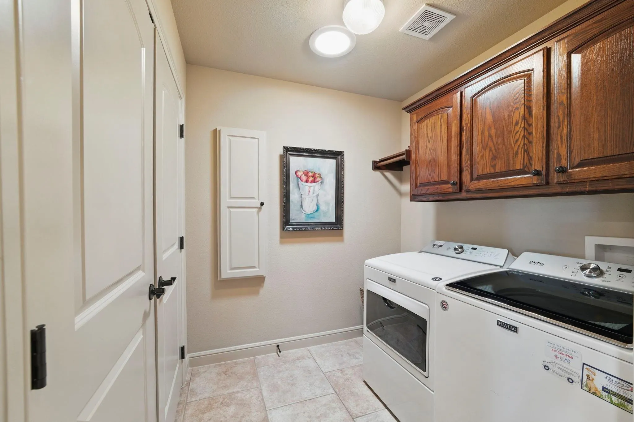 Built-in wood cabinetry, tiled flooring, recessed lighting, and panel doors