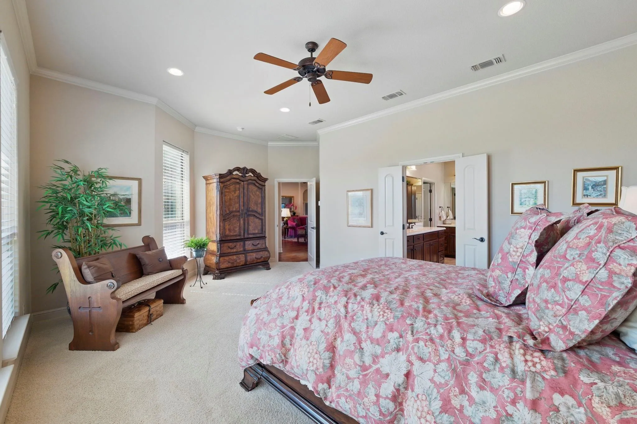 Spacious room with carpeted flooring, multiple windows with blinds, recessed lighting, and a ceiling fan