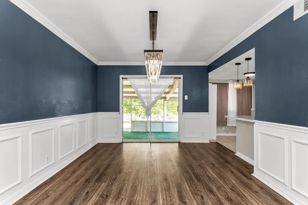 Wood-finish flooring with wainscoting and crown molding