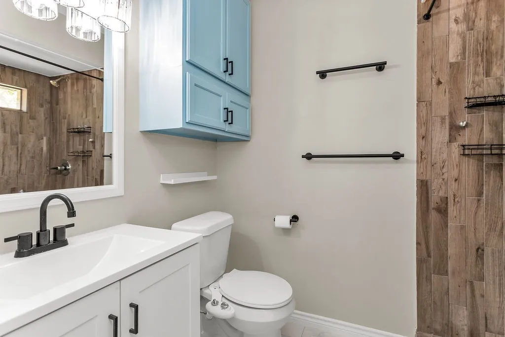 Vanity with single-basin sink and matte black faucet