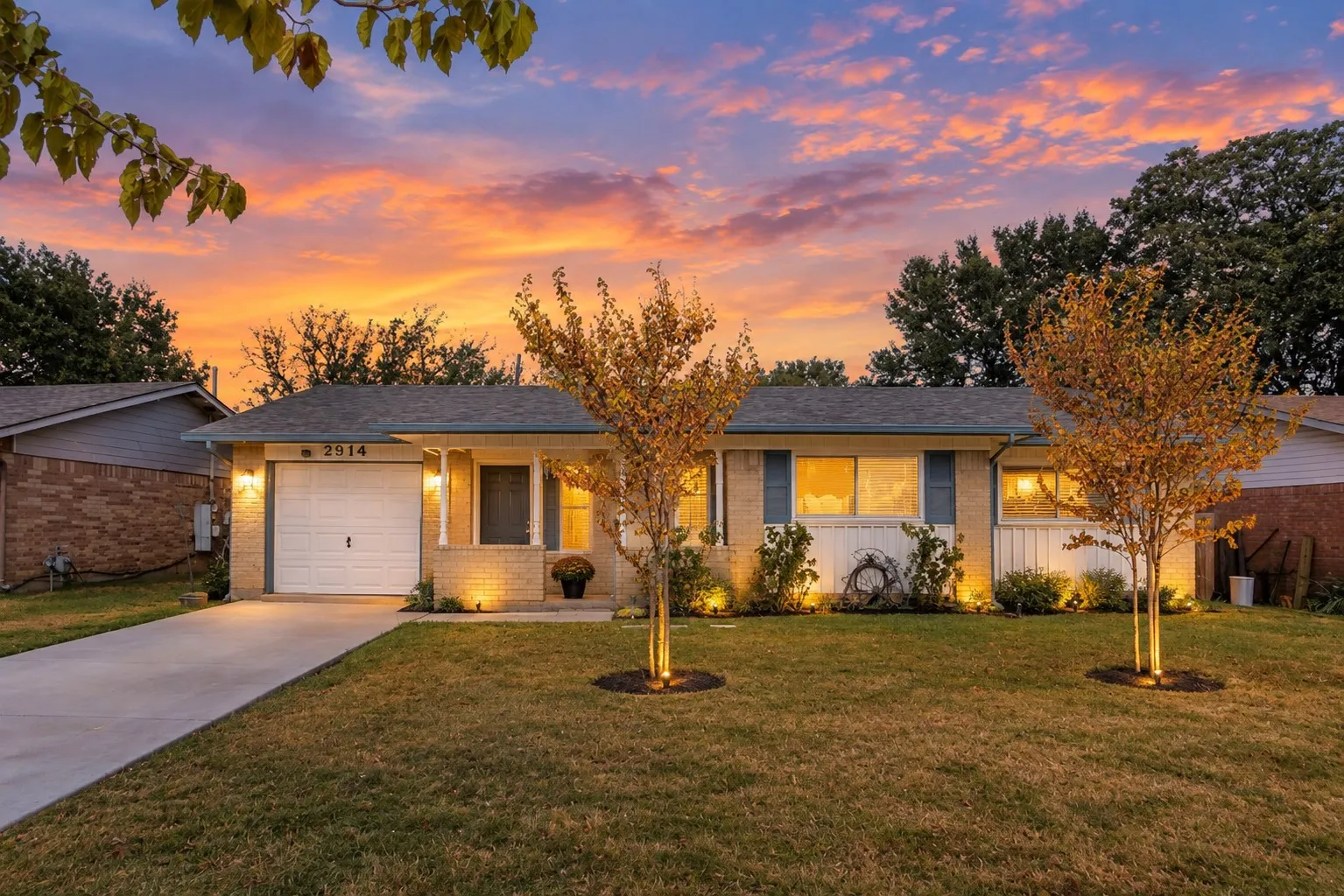 Brick and siding exterior with a single-car garage and concrete driveway