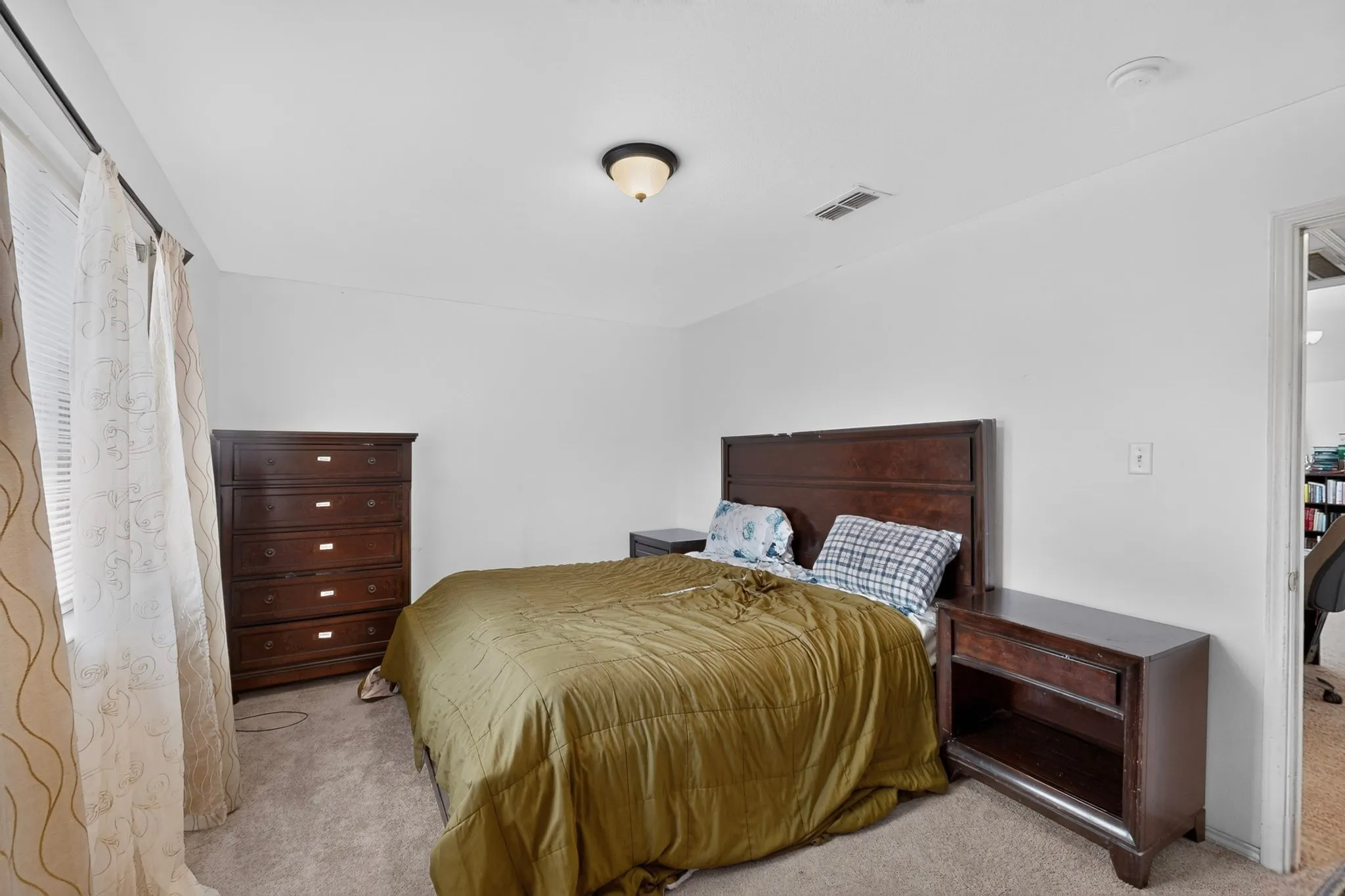 Carpeted flooring, window with blinds, recessed lighting, and wall-mounted light fixture