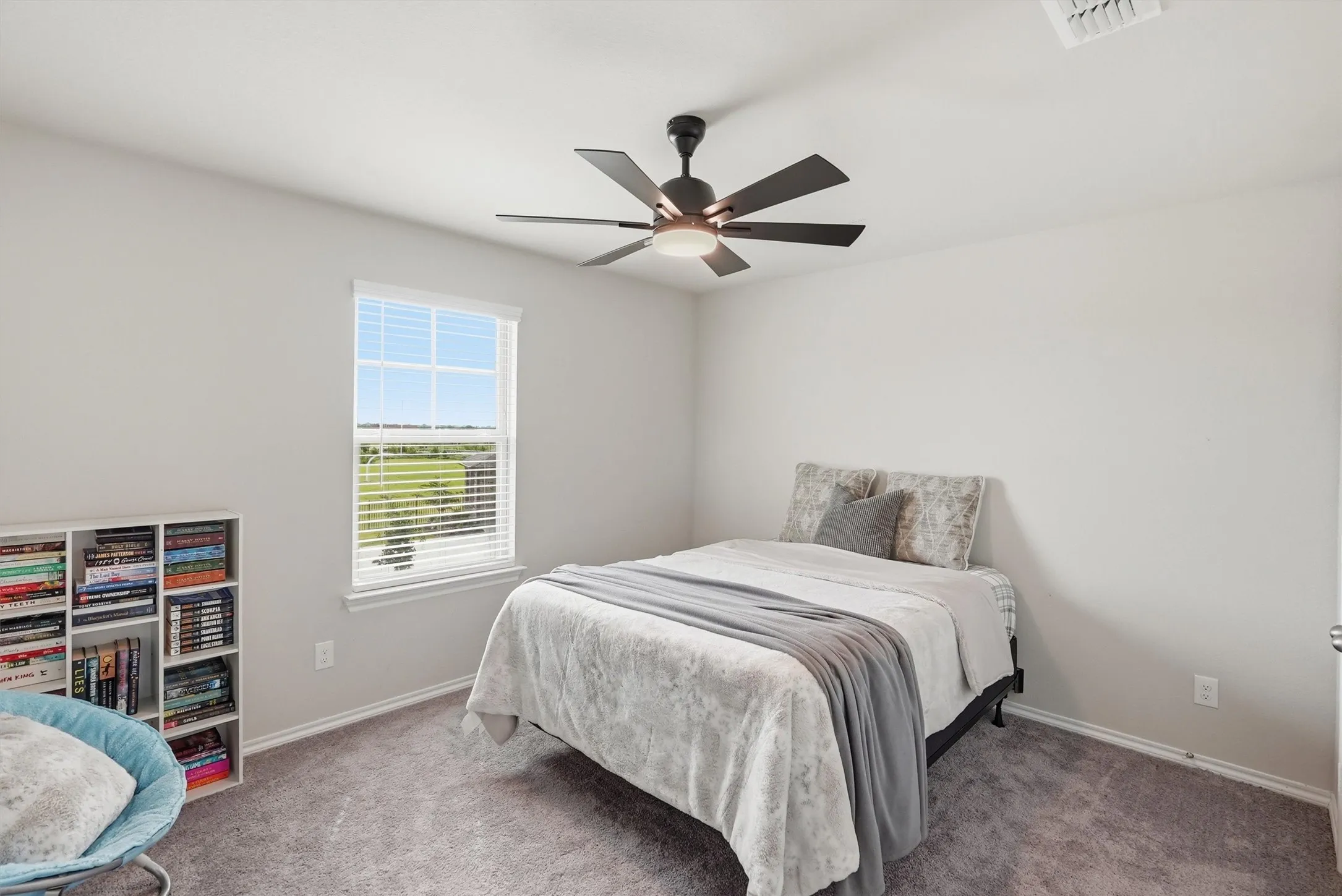 This secondary bedroom is positioned on the second floor and provides an added sense of privacy and quiet environment for work or rest.
