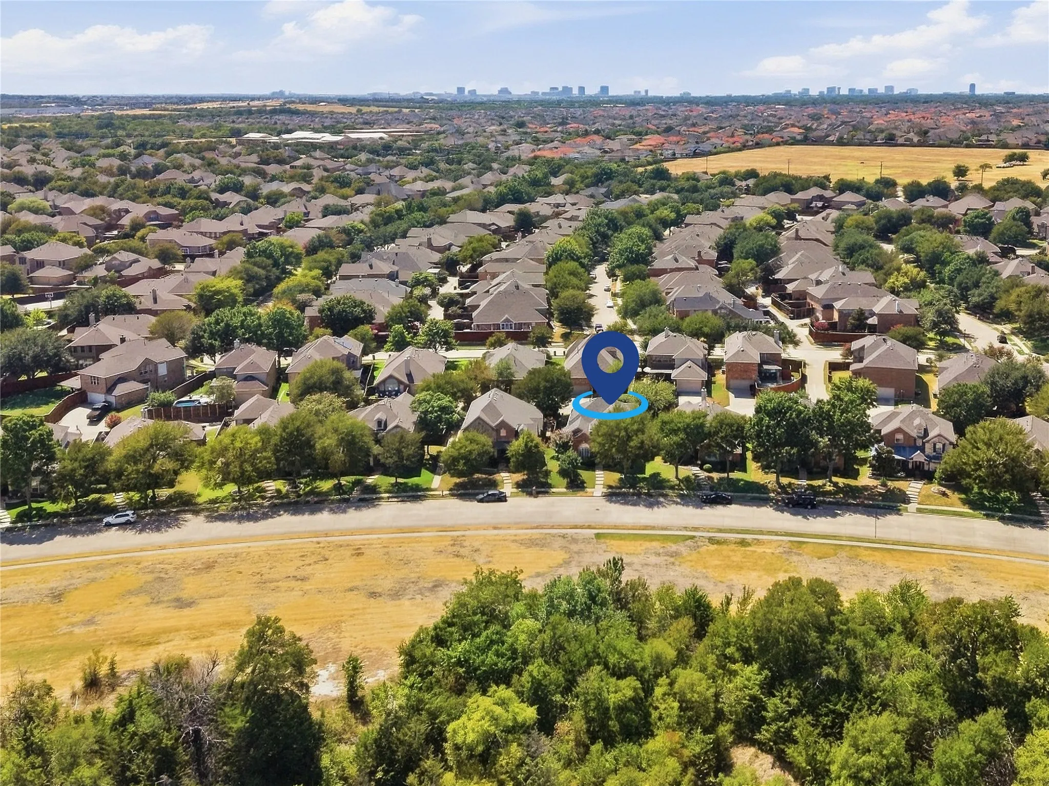 Residential neighborhood with mature trees and established homes