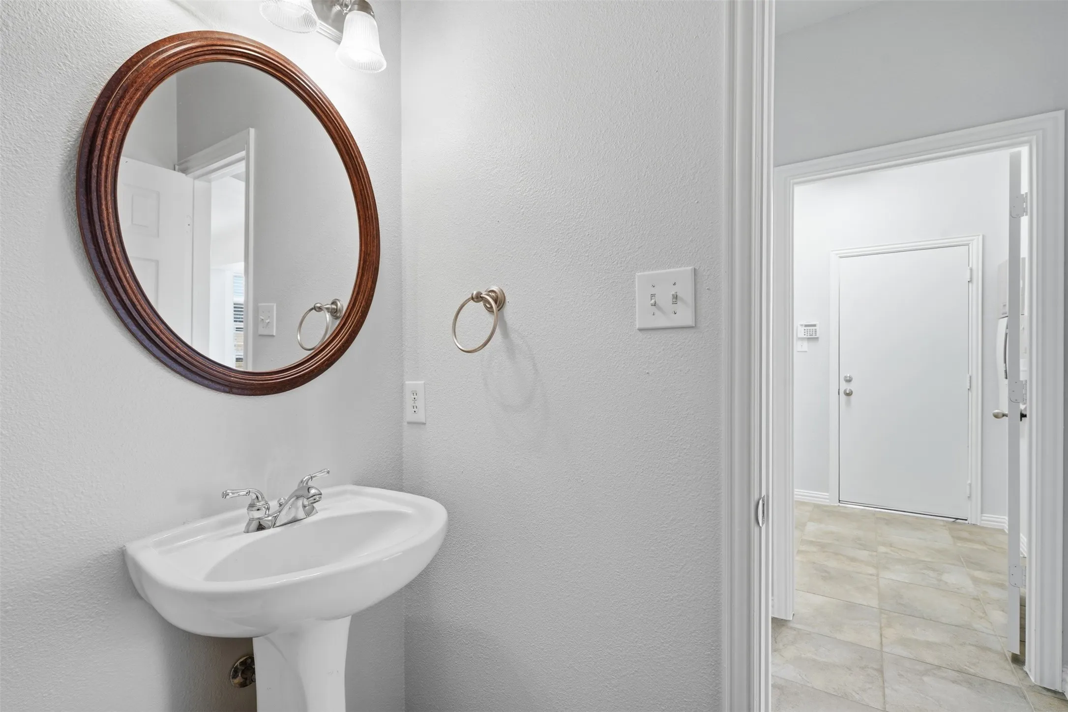 Half bathroom across from laundry & office