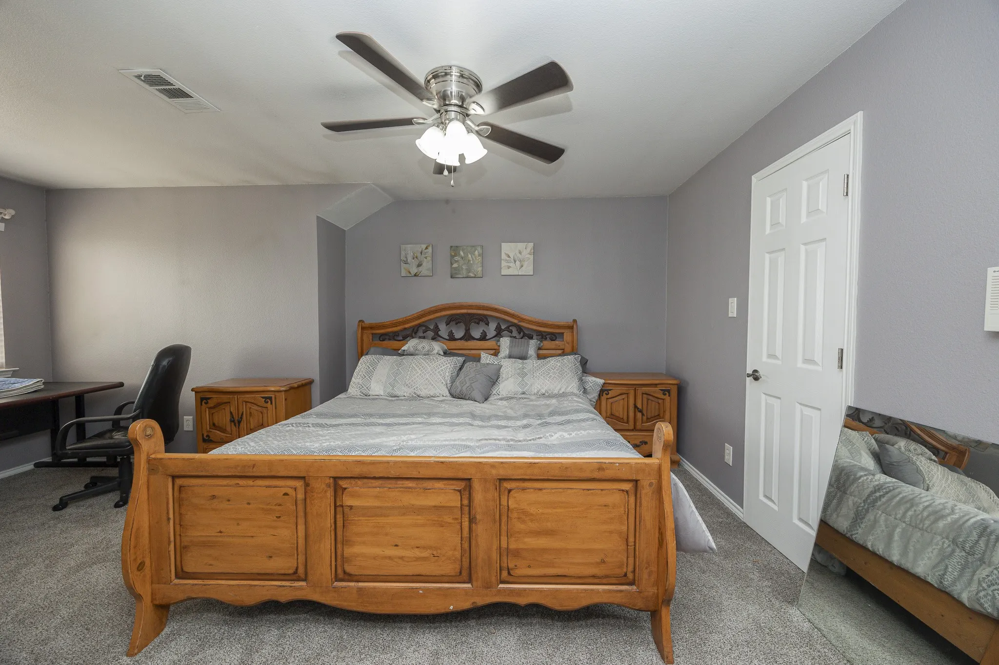 Carpeted flooring, ceiling fan, and painted walls