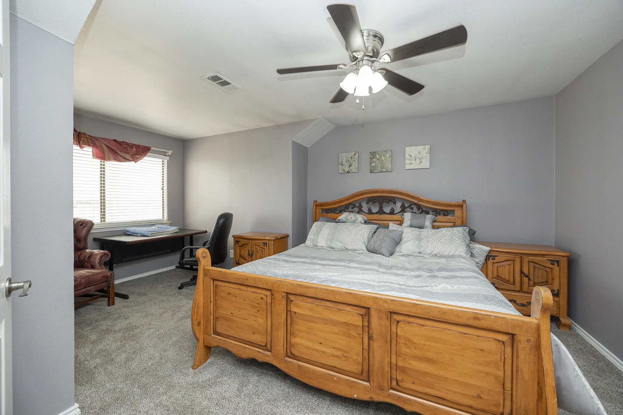 Carpeted room with a ceiling fan, window with blinds, and light gray walls
