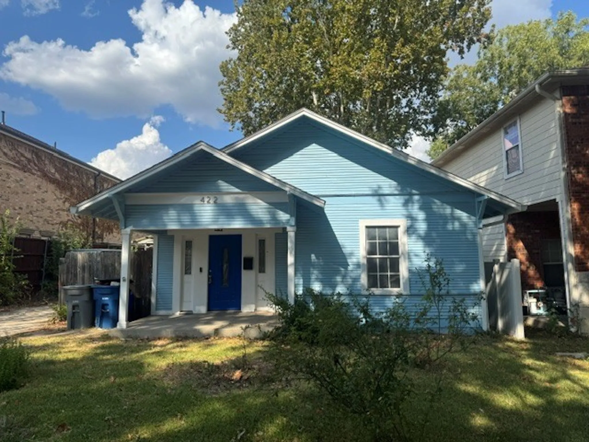Blue siding exterior with white trim