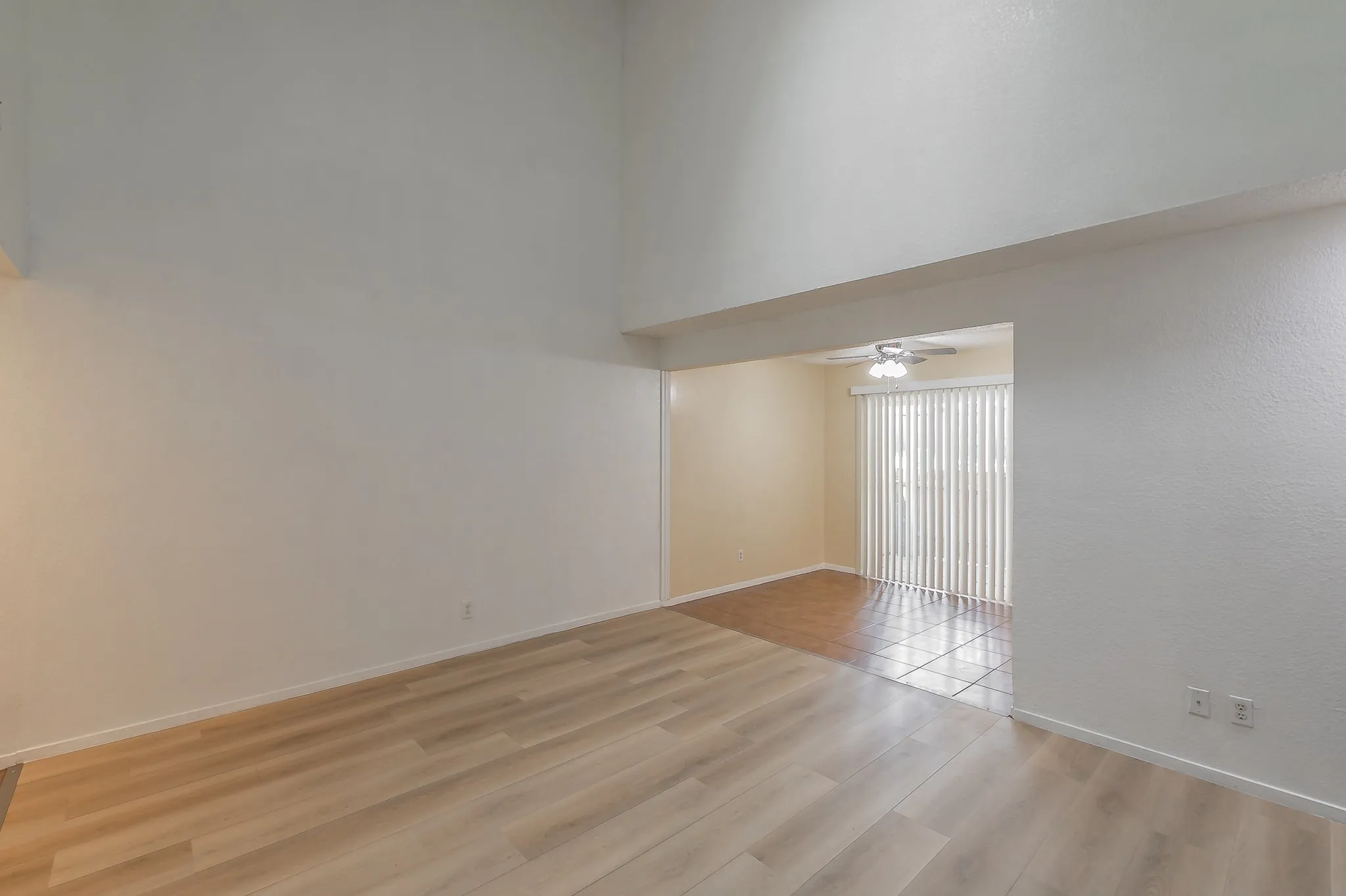 Living room with dinning area . Patio doors opens into carport