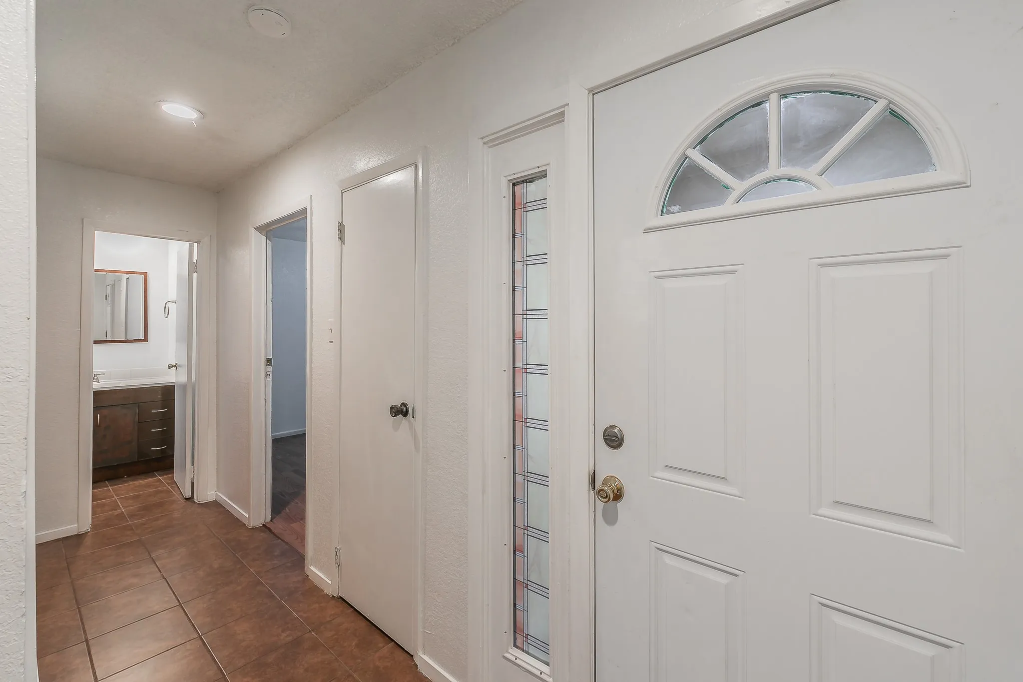 Welcome in, door at the end is hallway bathroom with bedroom entry on the right.