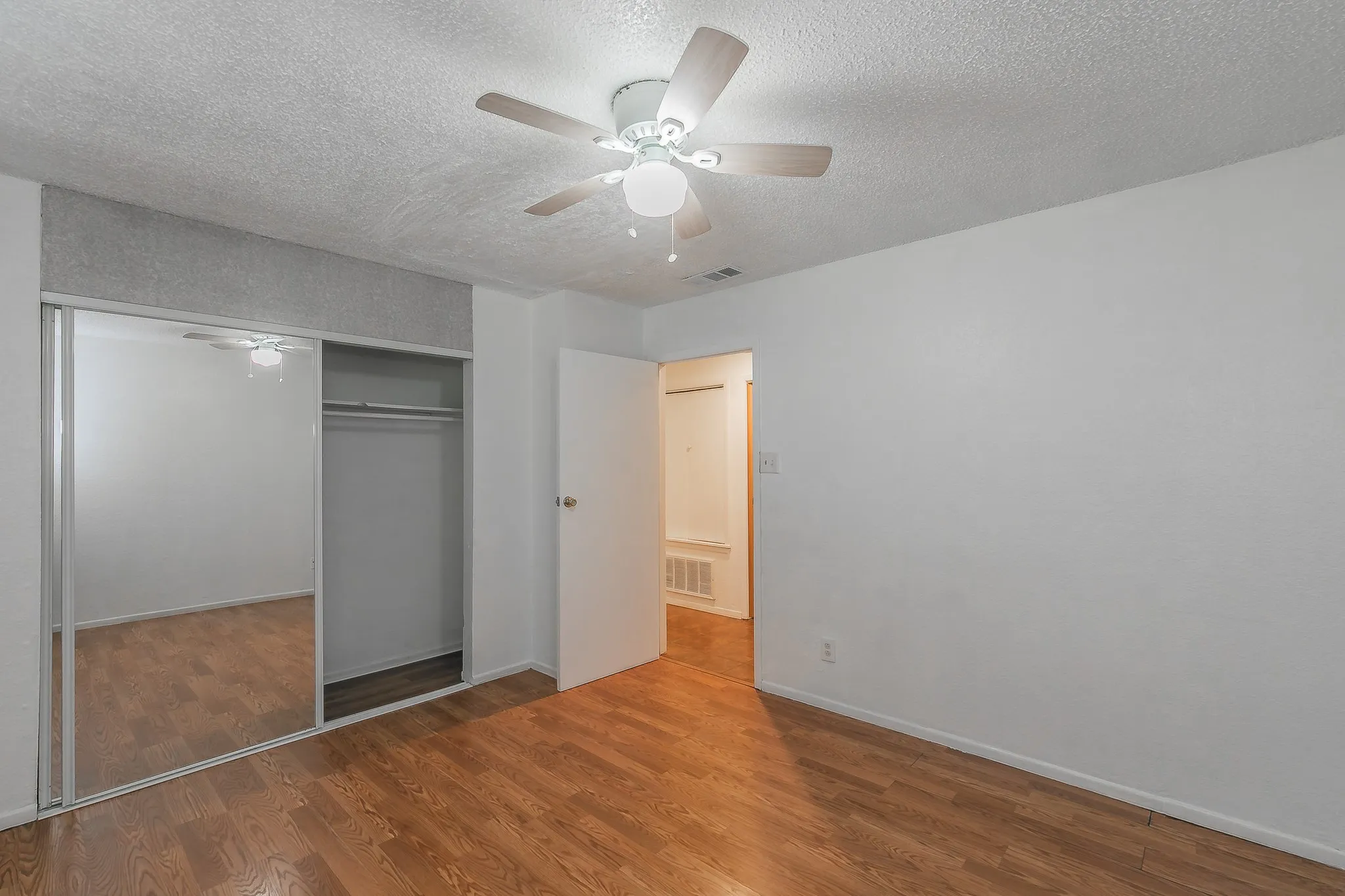 Hallway bathroom is to the right of the doorway.