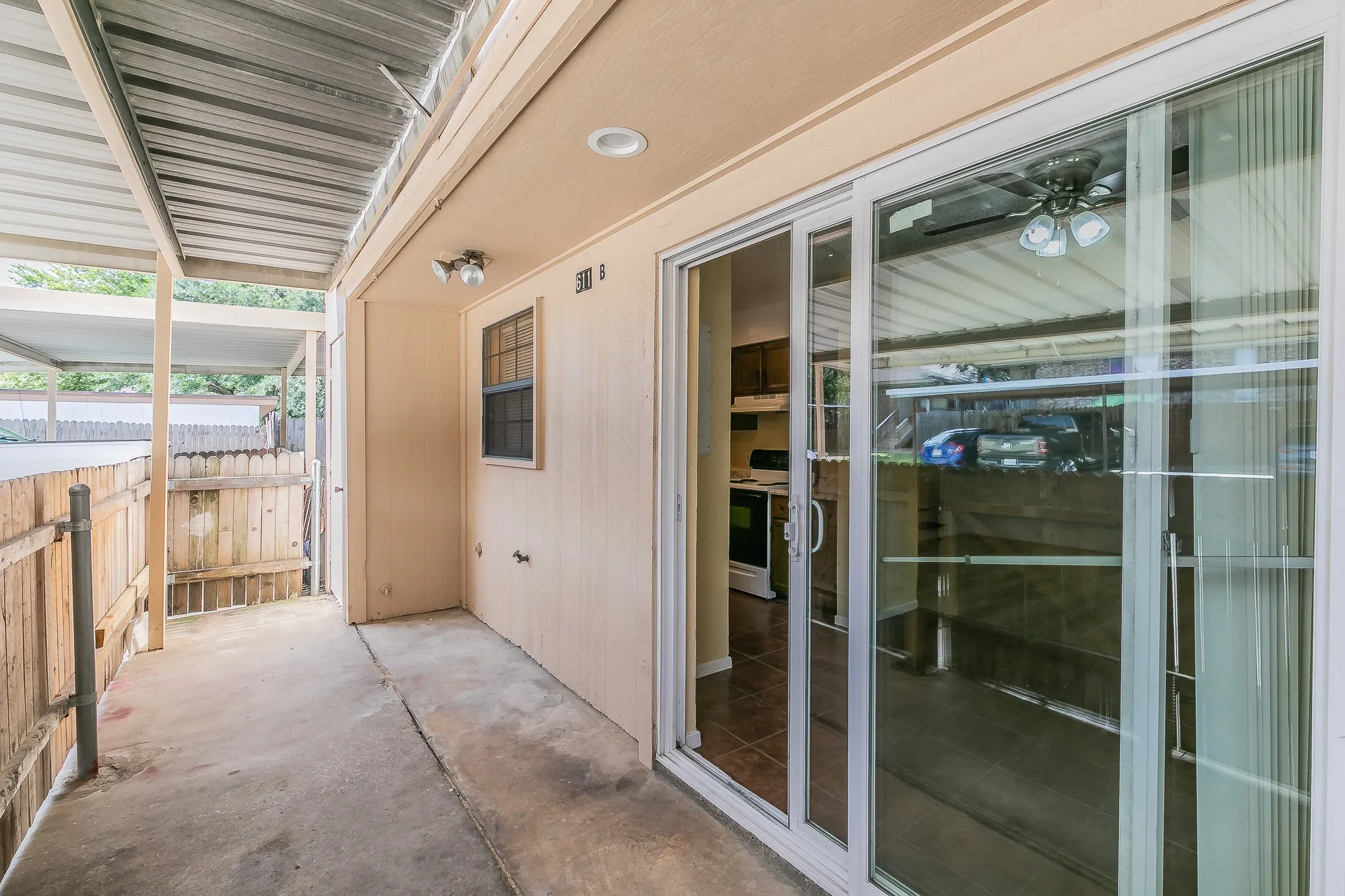 Carport with entry into the home.