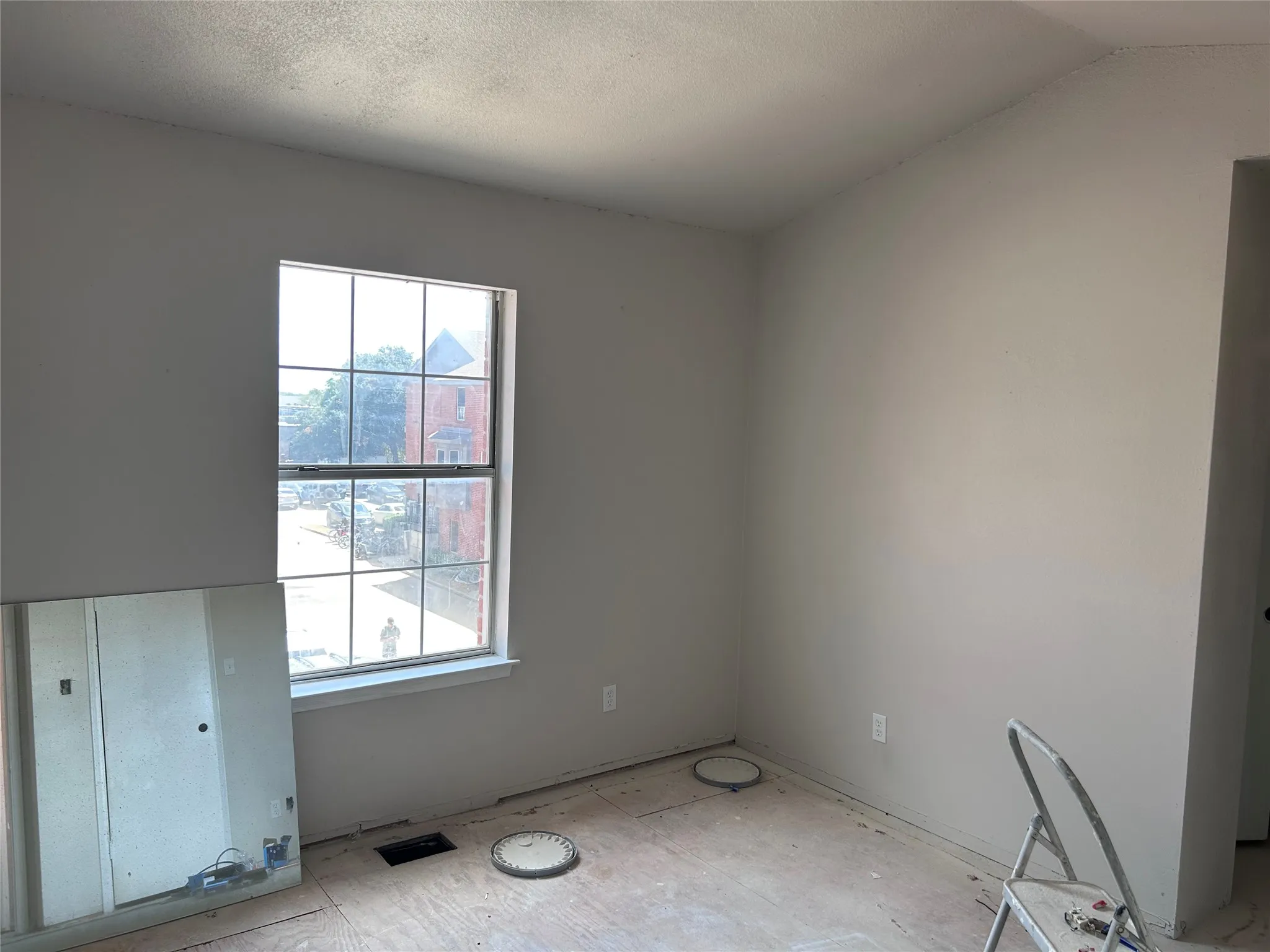 Renovations underway in one of two almost identical bedrooms. New vinyl plank flooring, ceiling fan with light, and 2" blinds are yet to come. There's multiple closets with plenty of space.