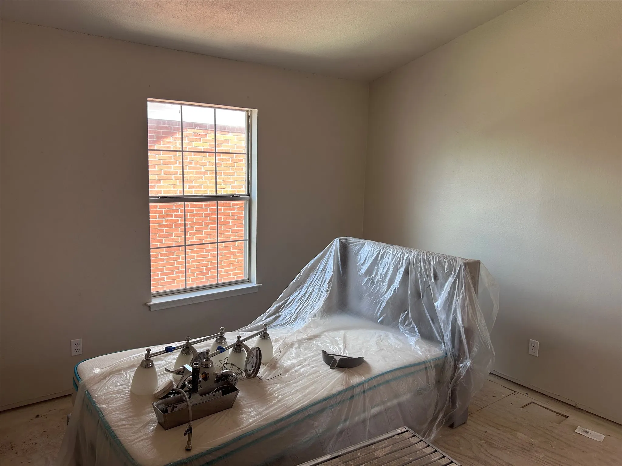 Renovations underway in one of two almost identical bedrooms. New vinyl plank flooring, ceiling fan with light, and 2" blinds are yet to come. There's multiple closets with plenty of space.
