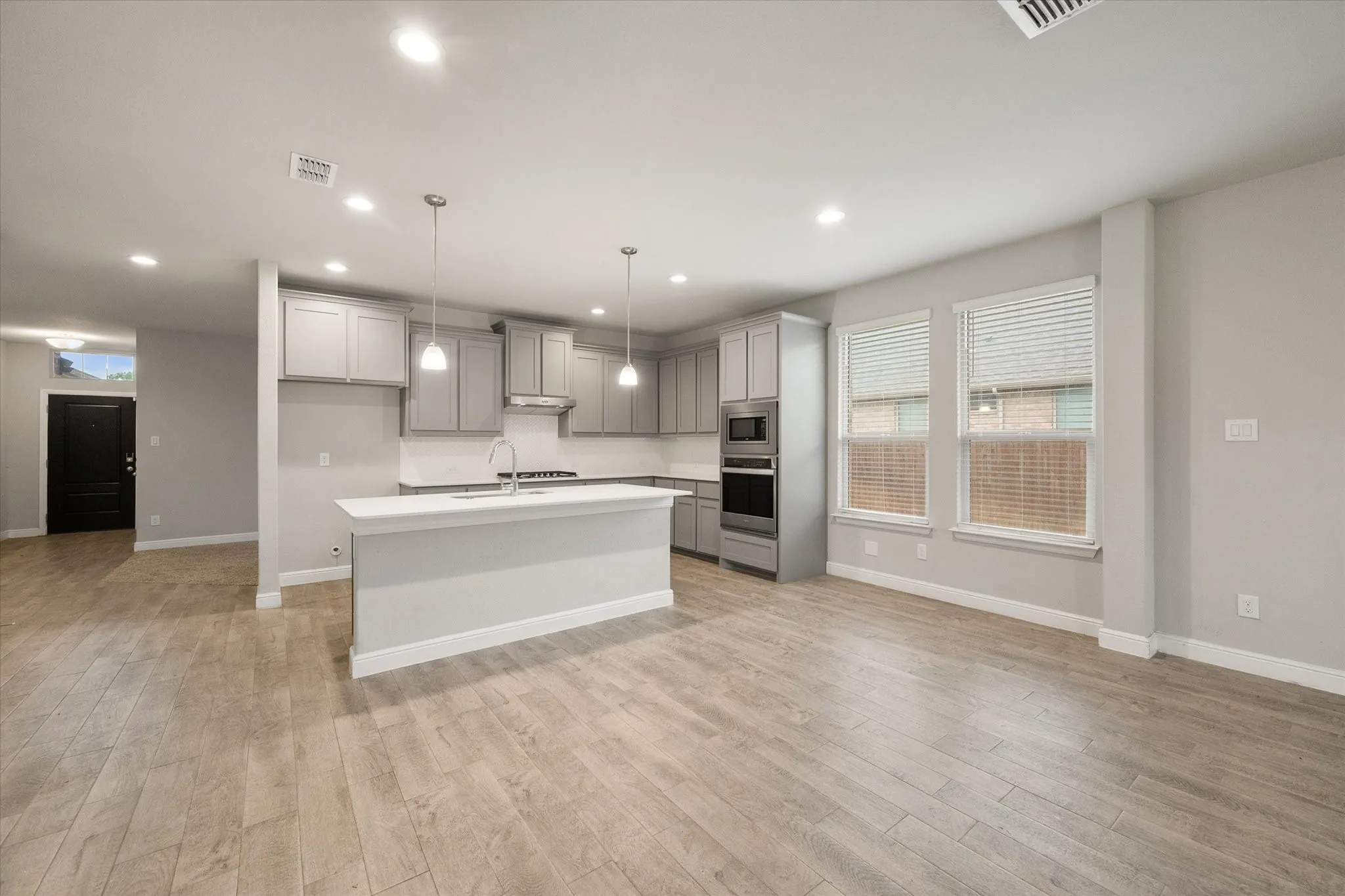 Another view of the open-concept living, dining and kitchen areas