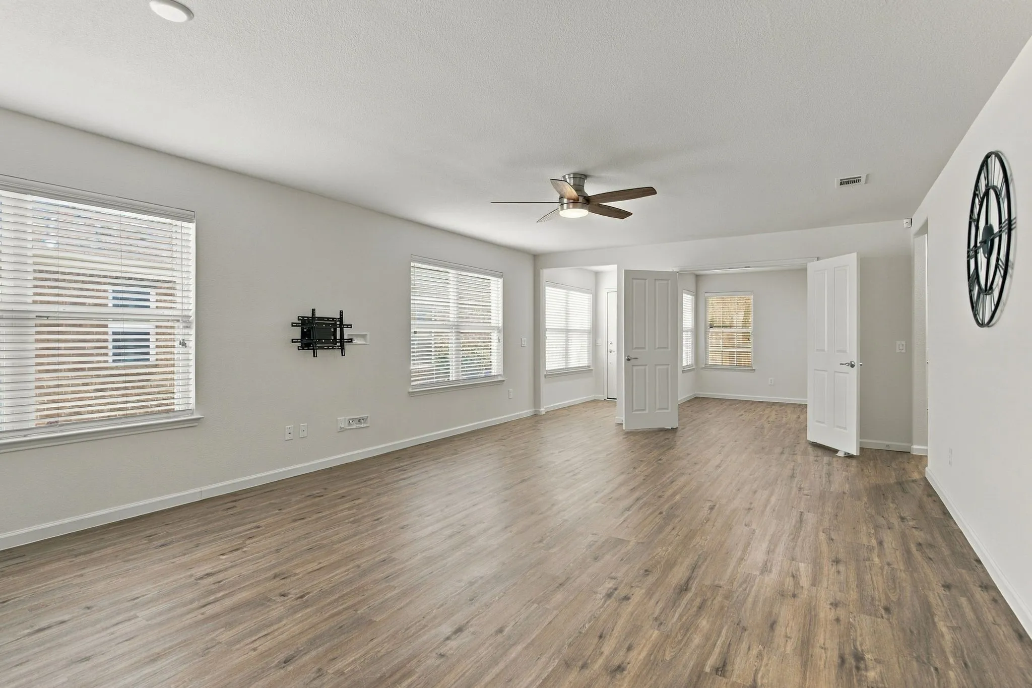 This Living Room View Reveals The Location Of The Home Office That Offers Double Doors For Privacy.