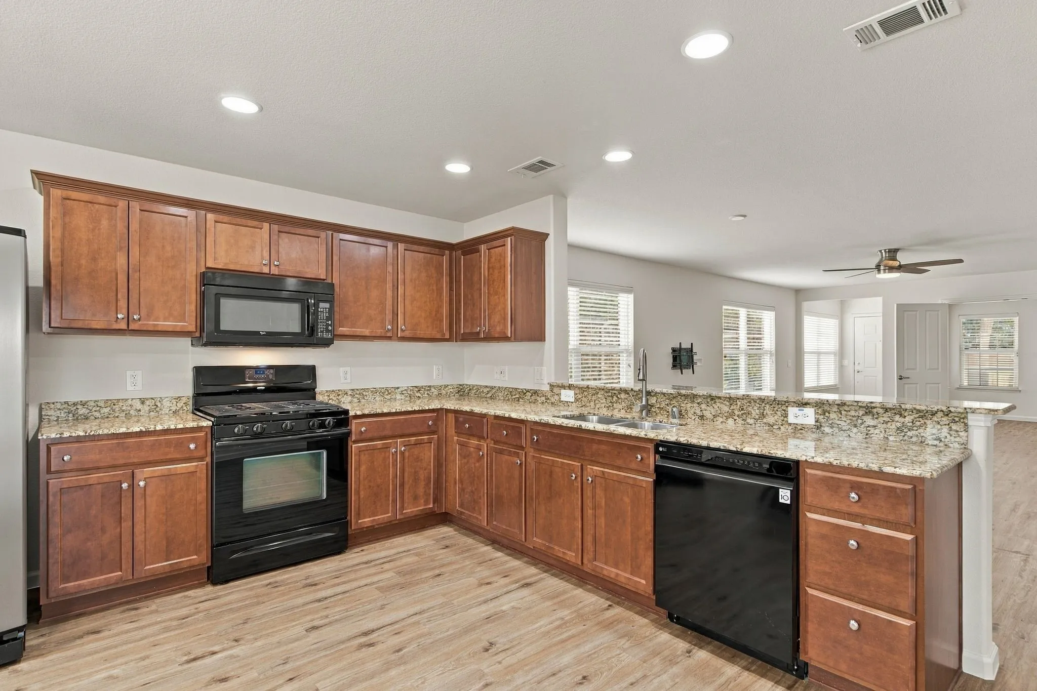 Your Meal Preparation Experience Is Optimized By Gorgeous Cabinetry, Granite Countertops, 5-Burner Gas Range, Microwave Vented To The Outside, Designer Faucet And Convenient Recessed Lighting.