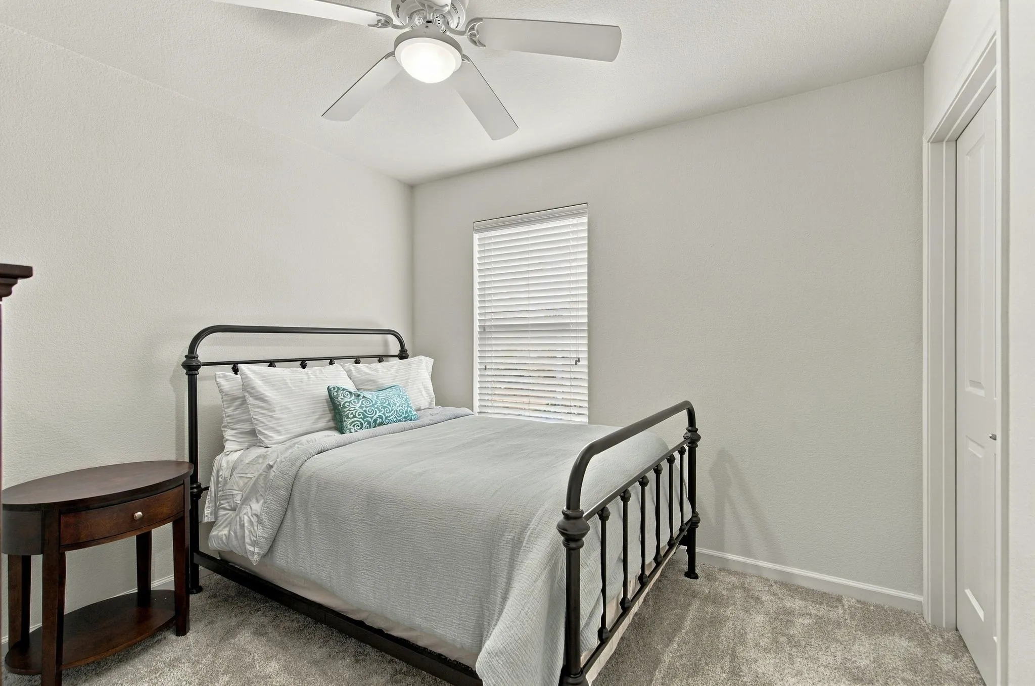 The Second Bedroom Is Ideal For Guests And Offers A Walk-In Closet, Ceiling Fan And Adjacent Full Bath.