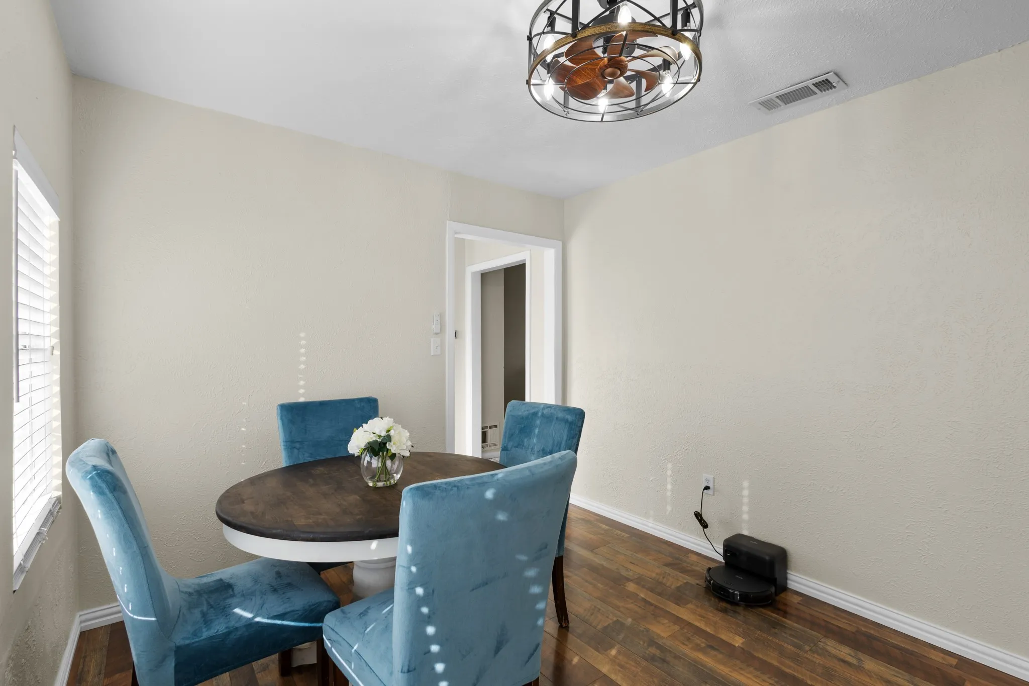 Wood-finish flooring with neutral wall tones and white trim
