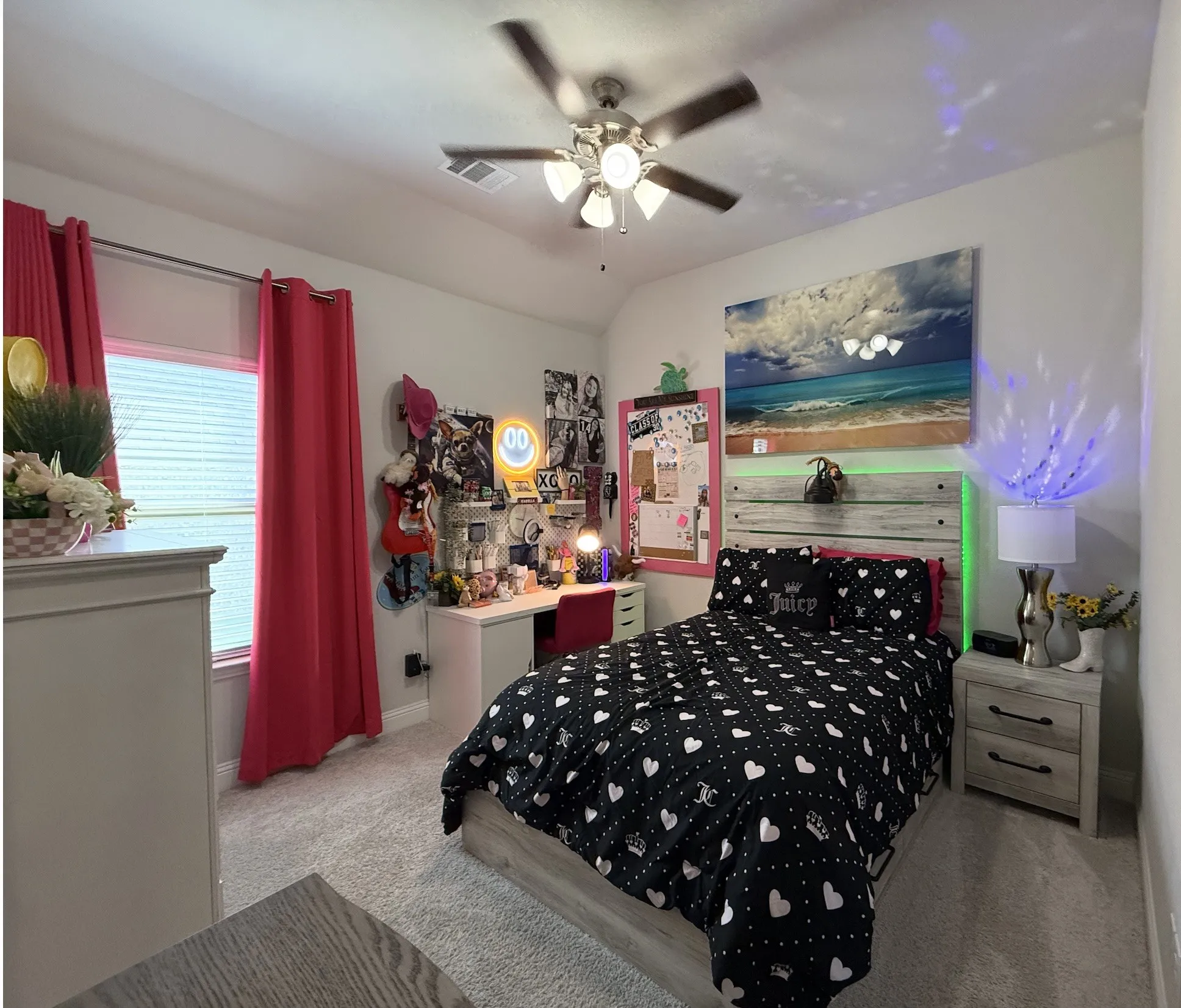 Wall-to-wall carpeting, window with blinds, ceiling fan with integrated lighting, built-in desk, and a rustic wood-finish headboard