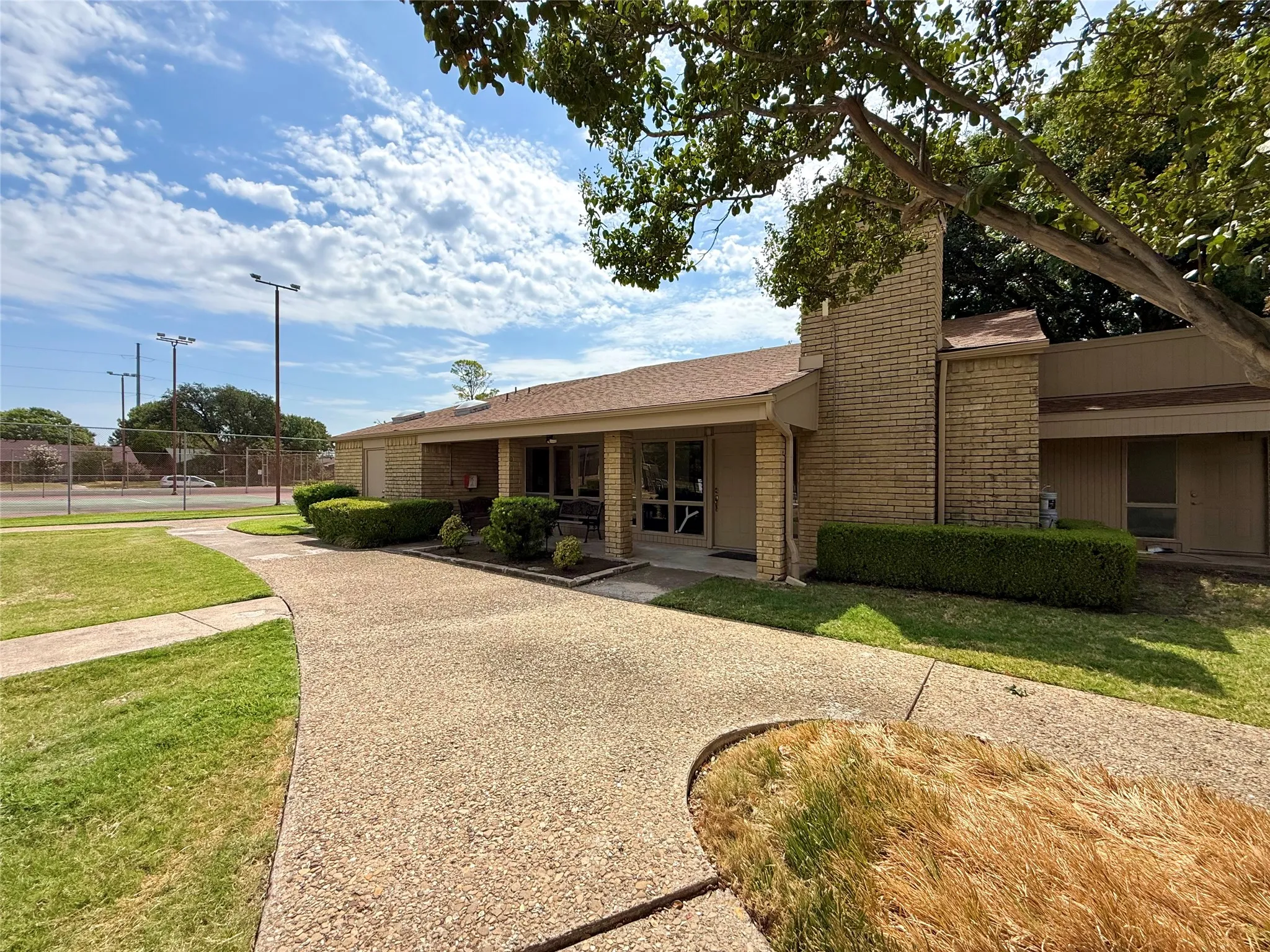 Community clubhouse conveniently located by the pool and tennis courts