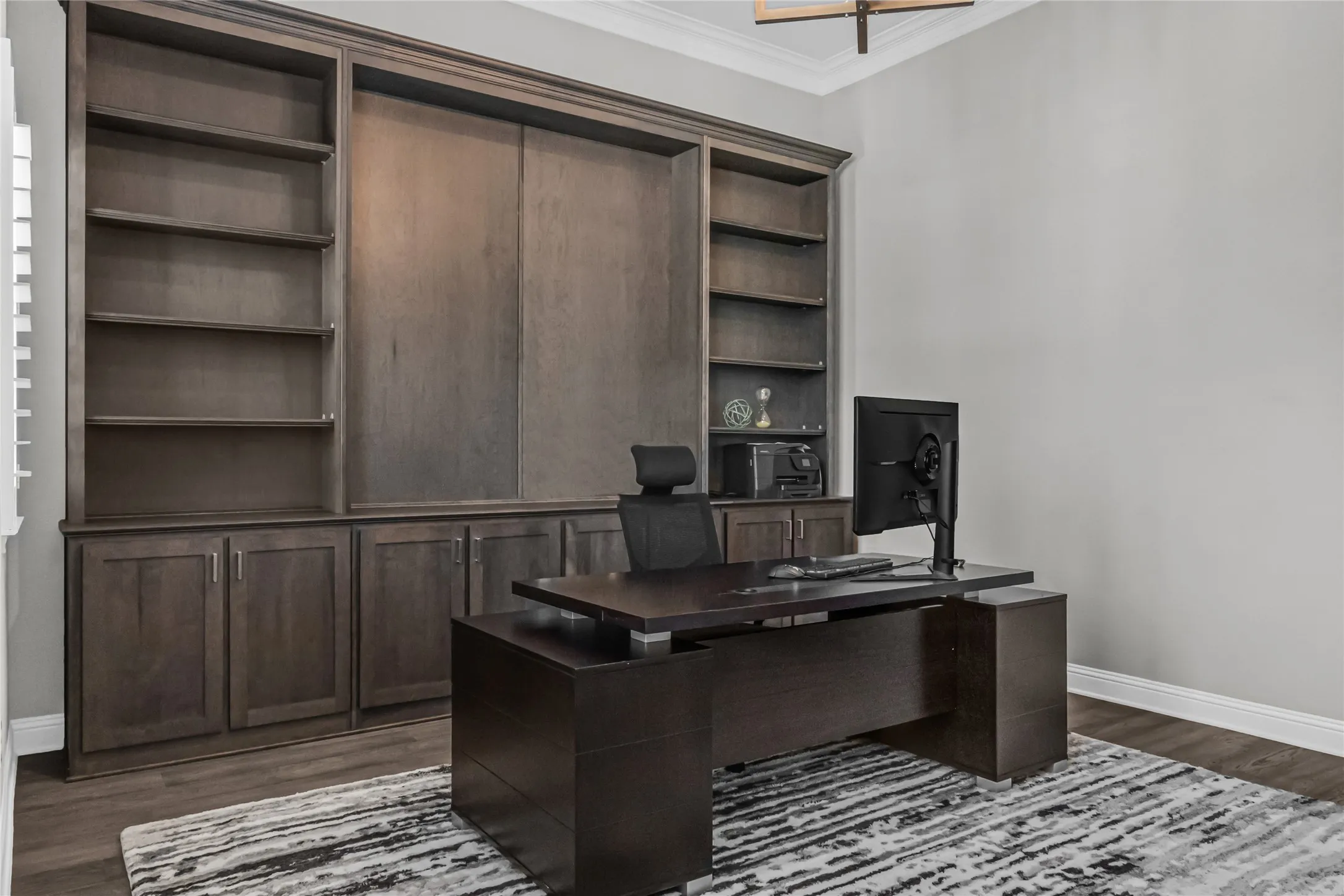 Built-in wood-finish cabinetry and shelving