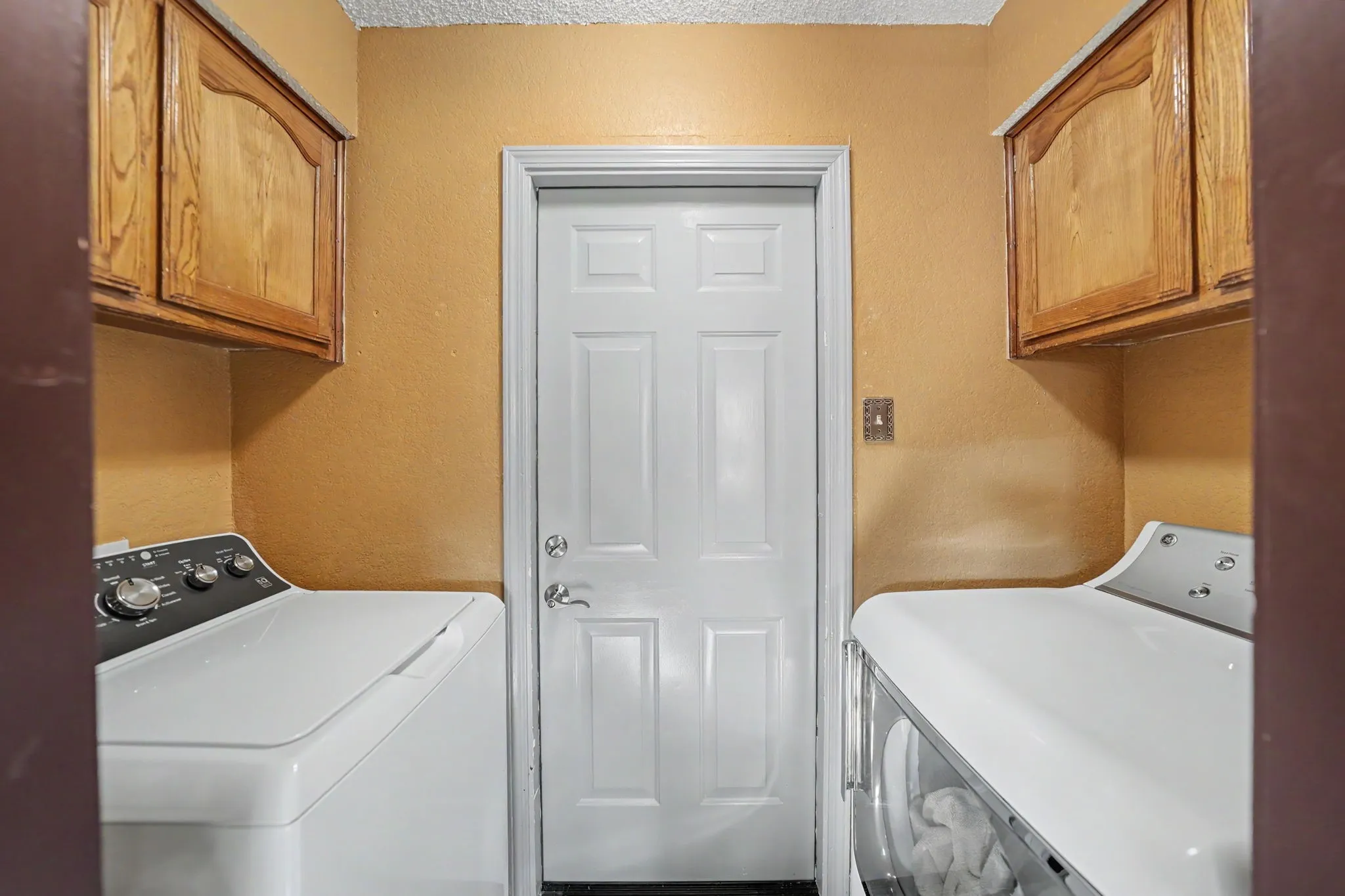 Upper wood-finish cabinetry