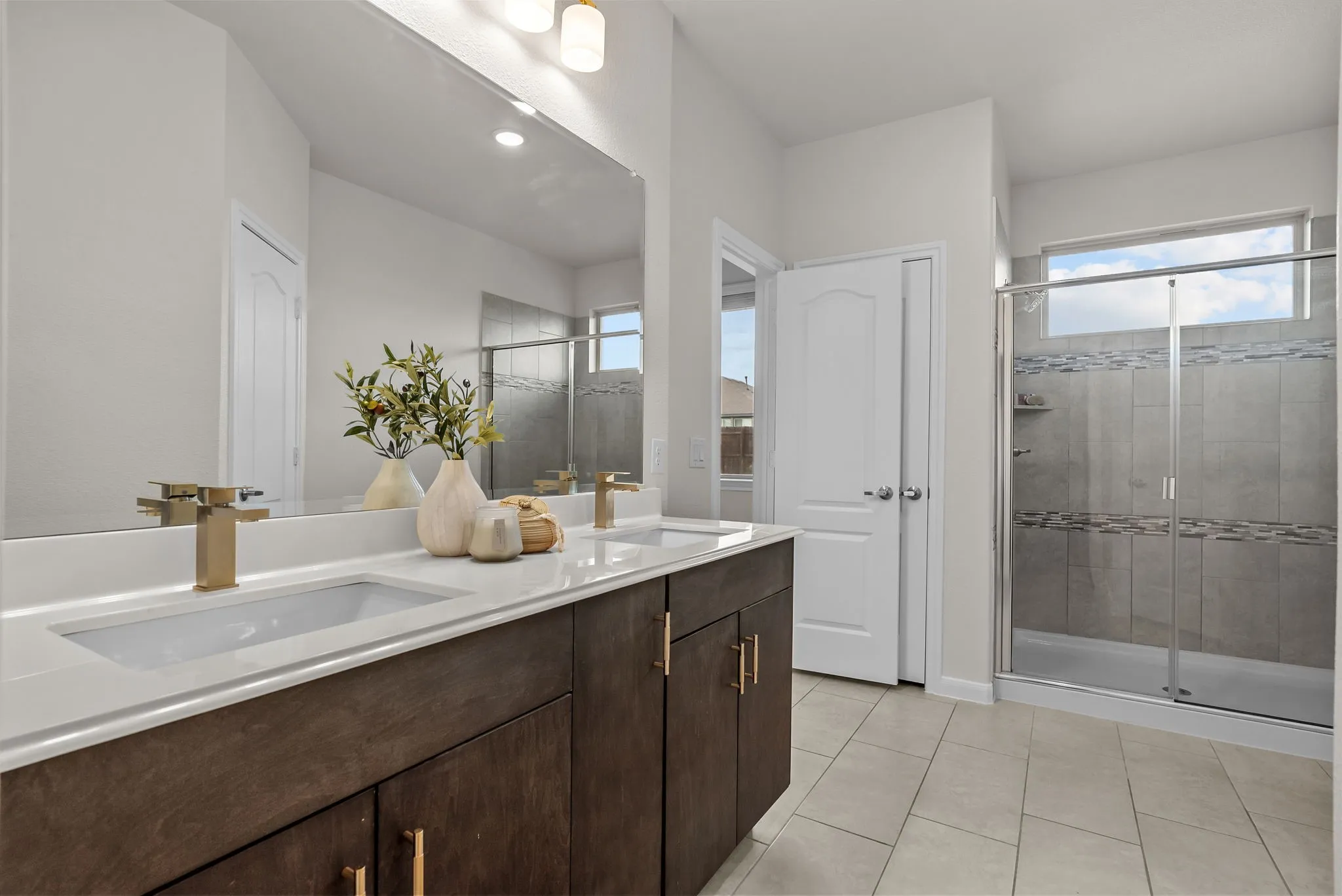 Primary bathroom with dual sinks and oversized shower