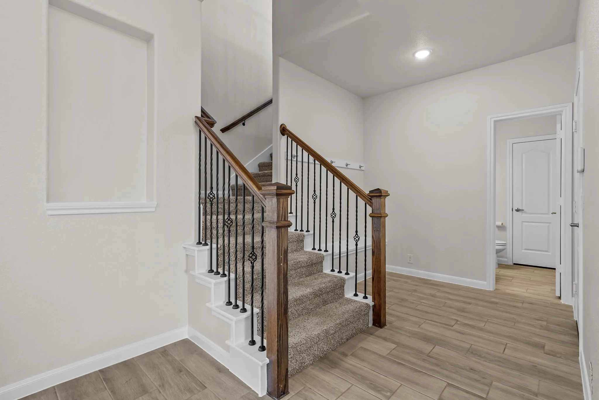 Wood railing with iron balusters