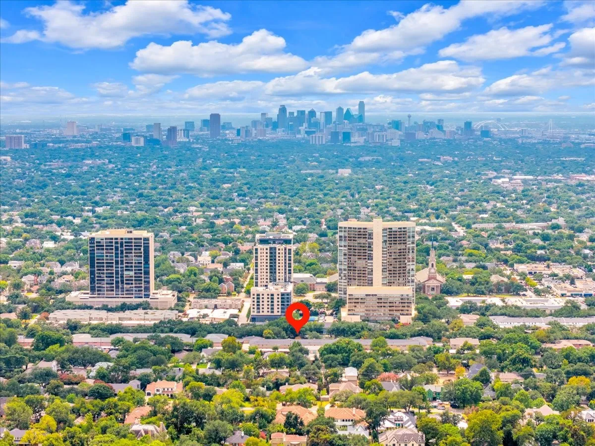 Aerial perspective showcasing a sprawling urban landscape with a distant city skyline