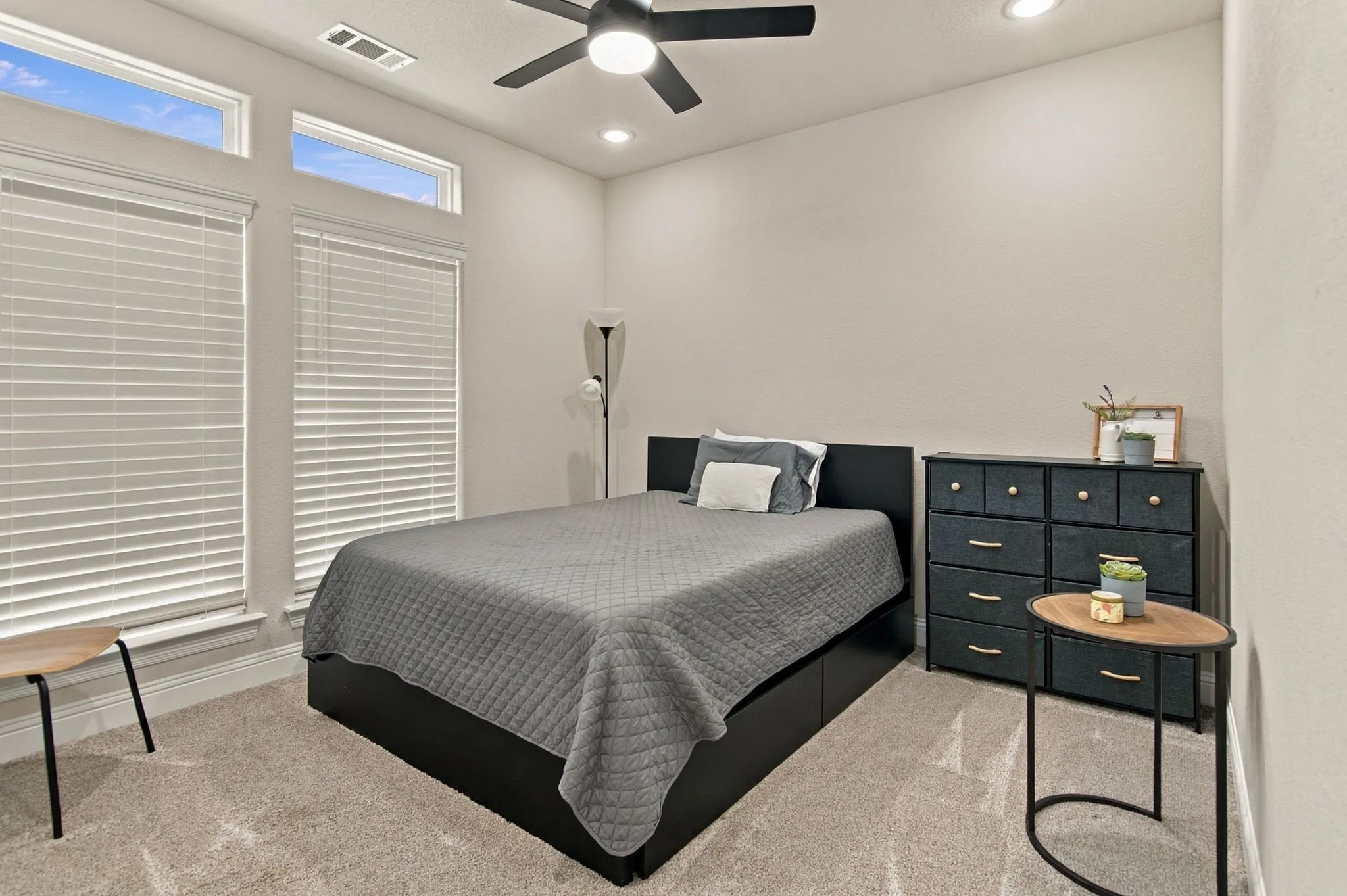 Recessed lighting, ceiling fan, high ceilings, large windows with blinds, and carpeted flooring
