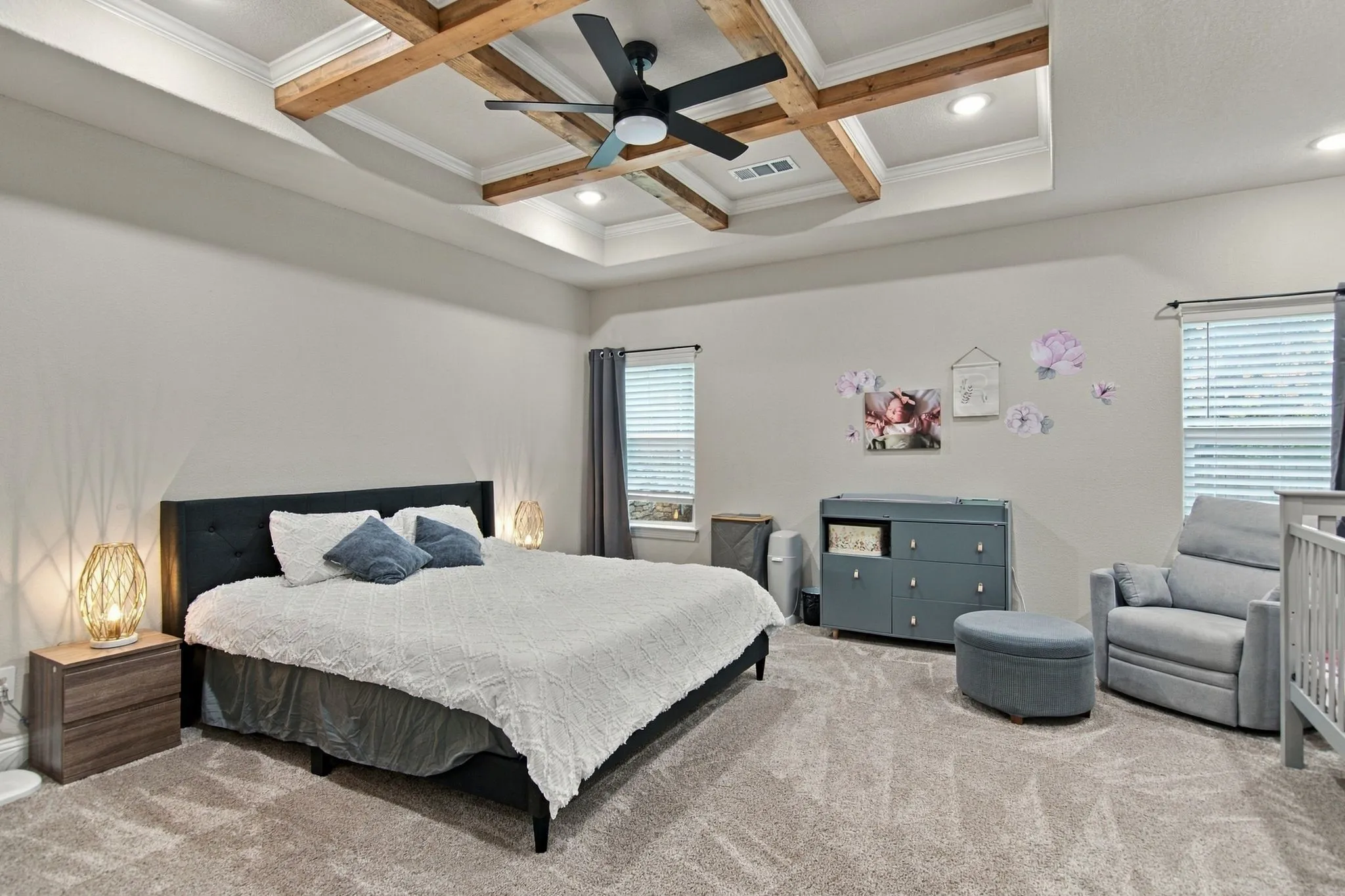 Tray ceiling with wood-finish beams and recessed lighting