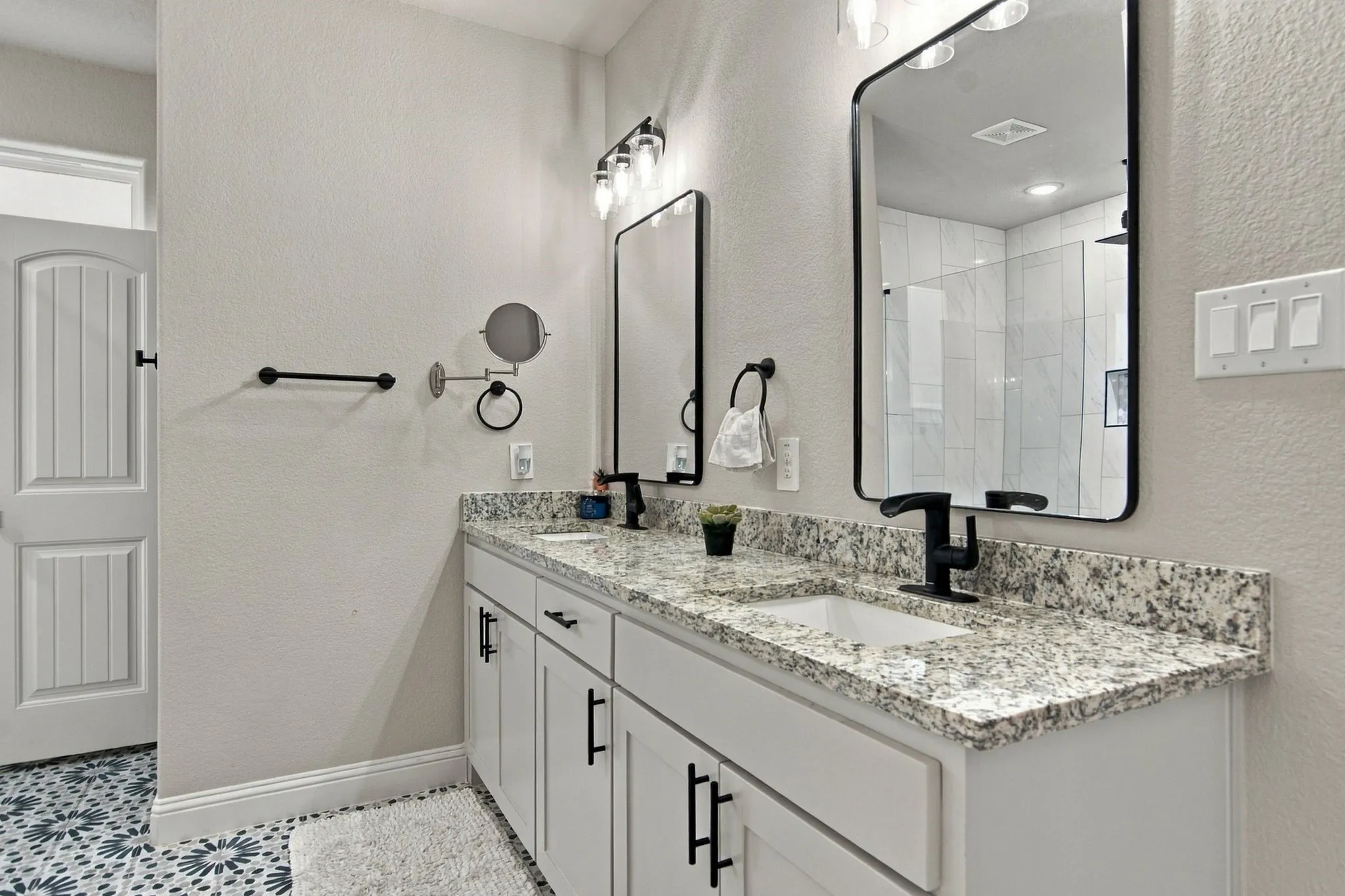 Dual vanity with stone-finish countertops and integrated sinks