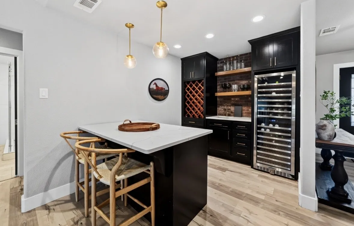 Wet bar in living room with large wine fridge